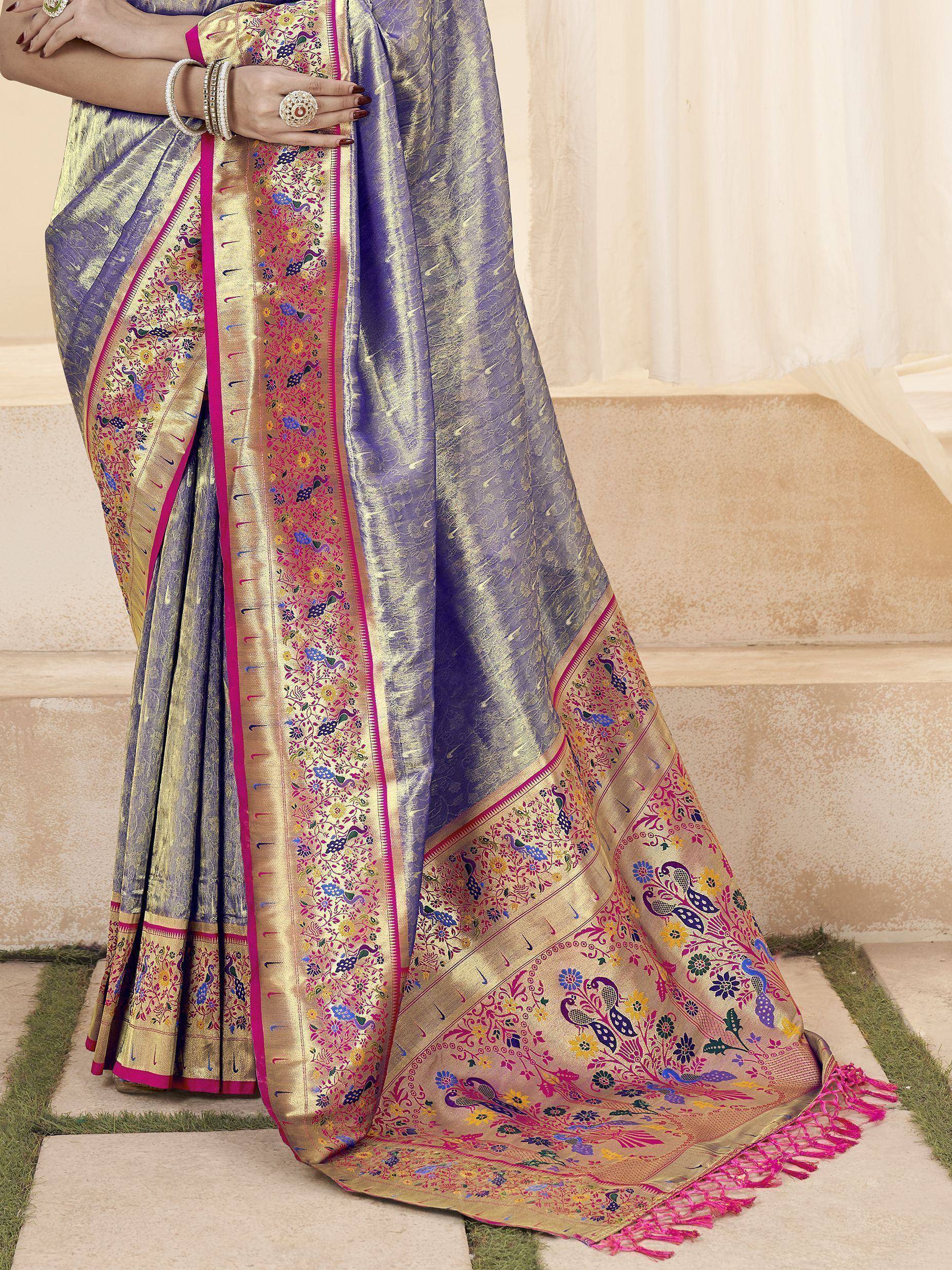 Purple and gold designer saree with peacock embroidery and pink border, perfect for Indian ethnic wear occasions.