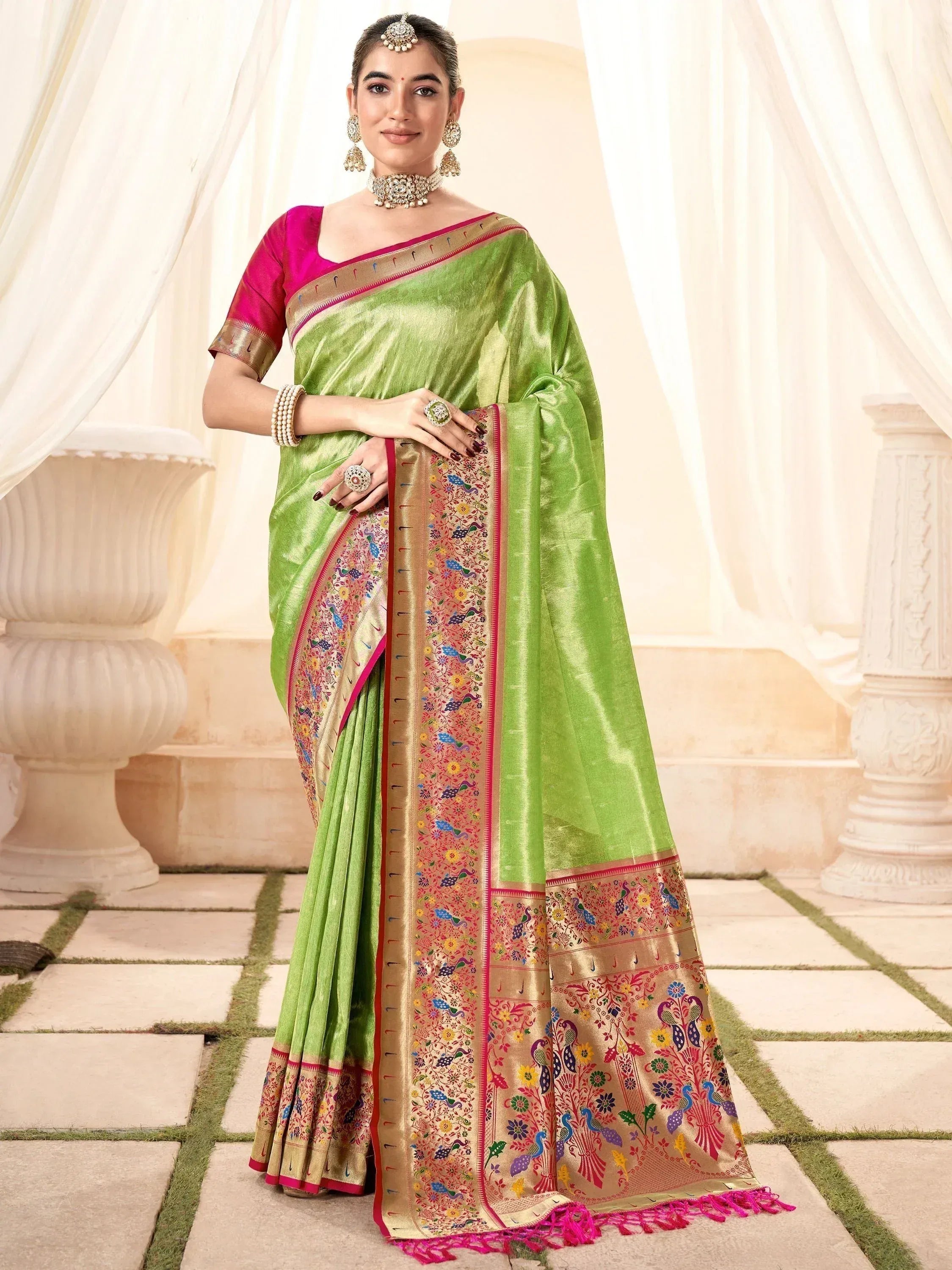 Green silk saree with peacock embroidery, pink blouse, ethnic jewelry for Indian occasions