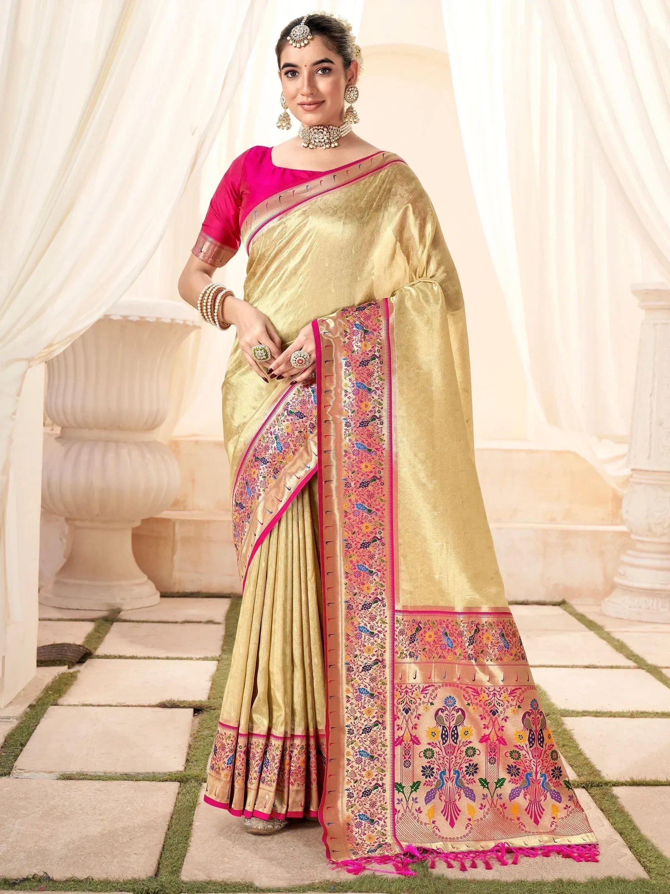 Golden saree with pink border and peacock embroidery, paired with matching blouse, ideal for Indian ethnic occasions