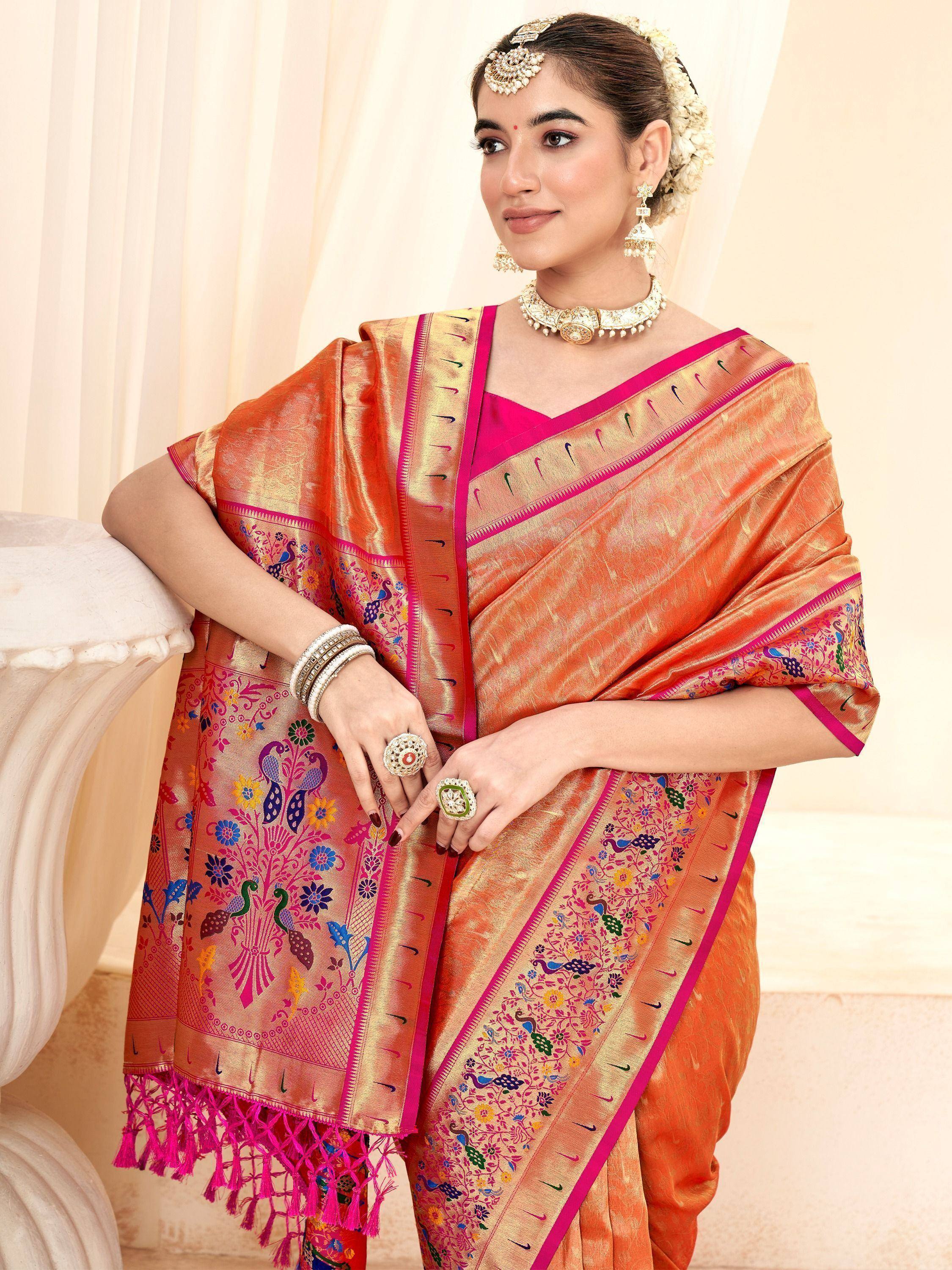 Orange and pink embroidered saree with peacock motifs, traditional Indian ethnic wear for women