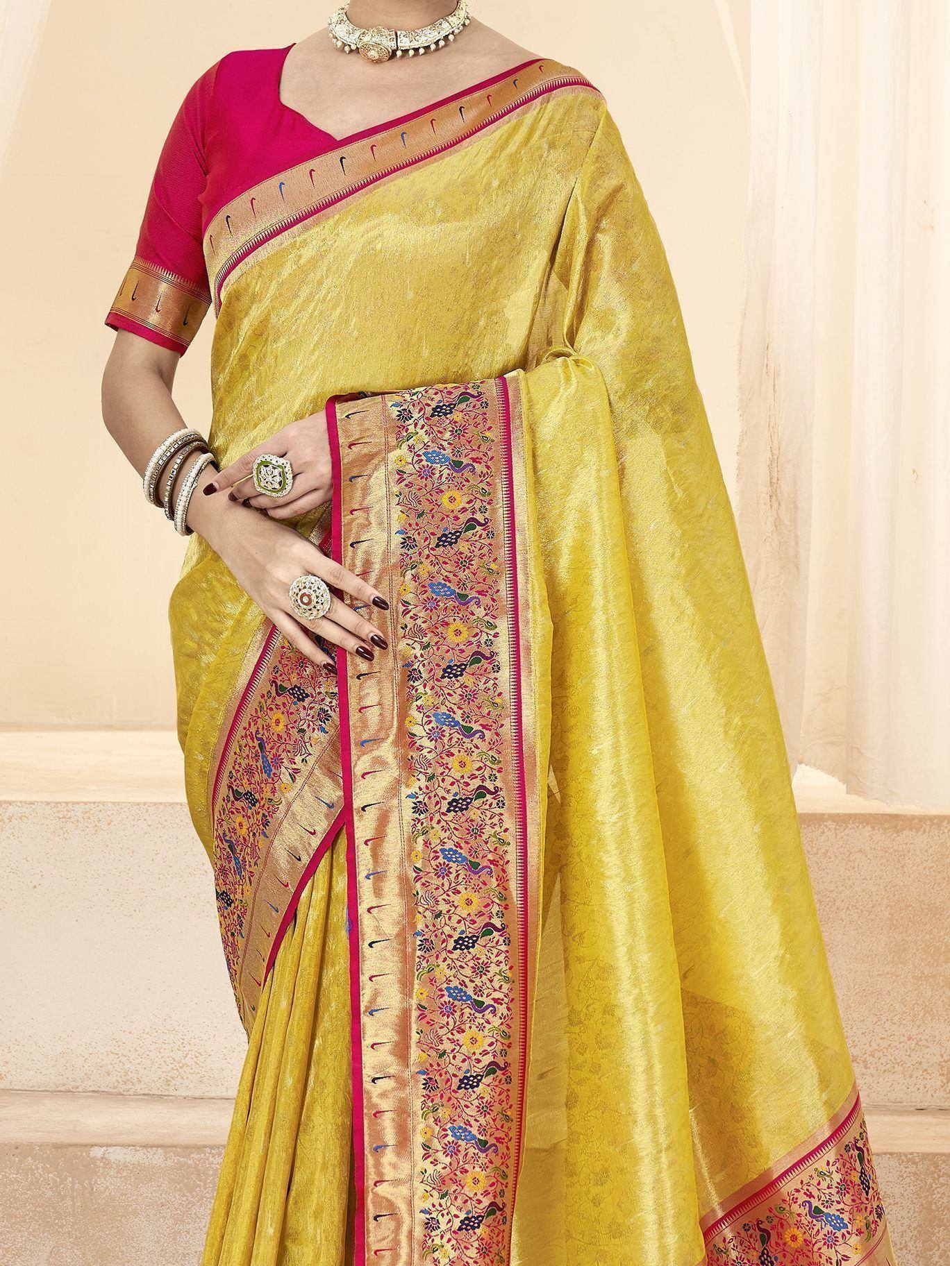 Yellow silk saree with peacock embroidery, pink blouse, ethnic jewelry for Indian occasions