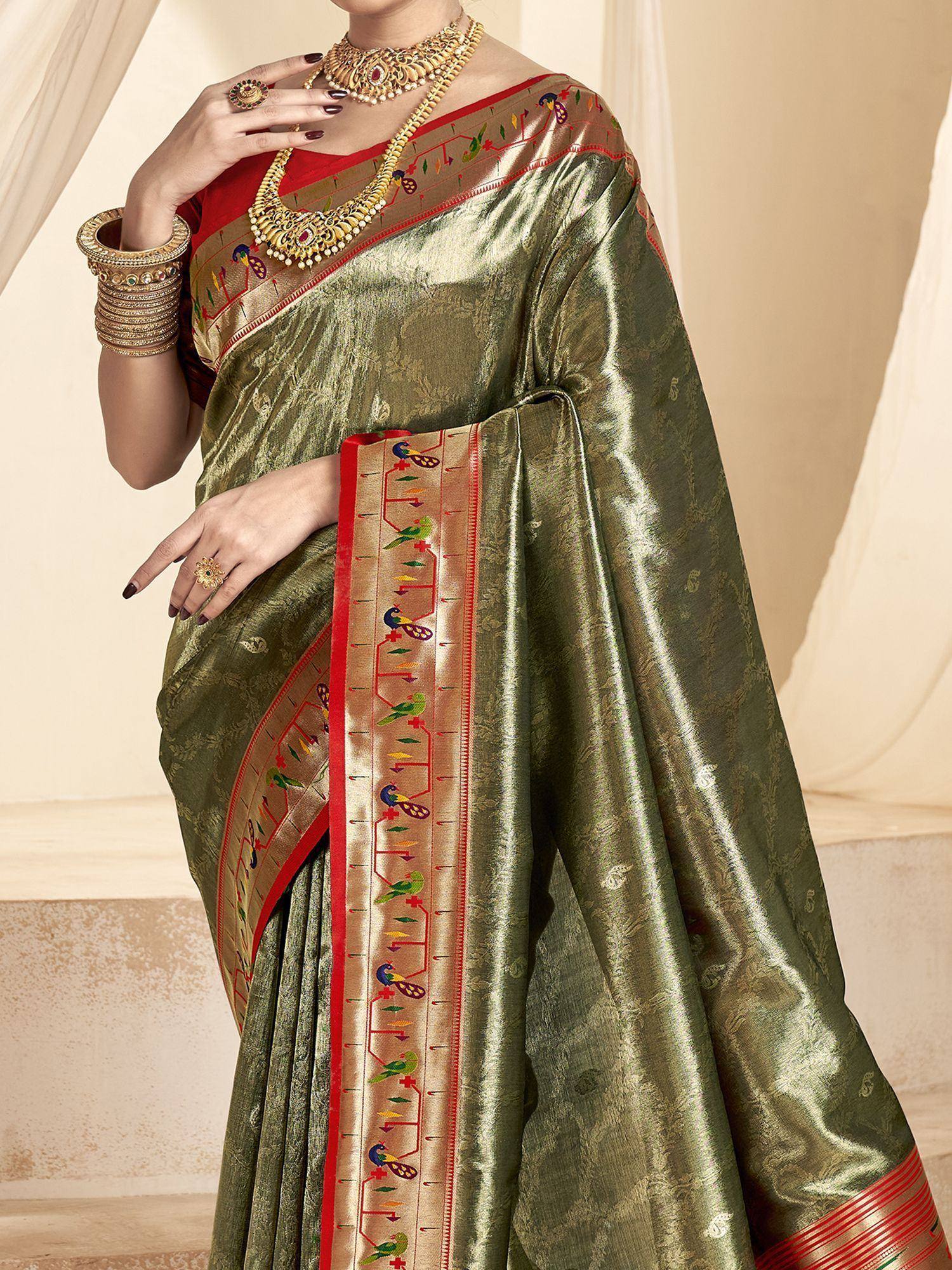 Olive green silk saree with peacock border, red blouse, and gold jewelry for Indian ethnic wear