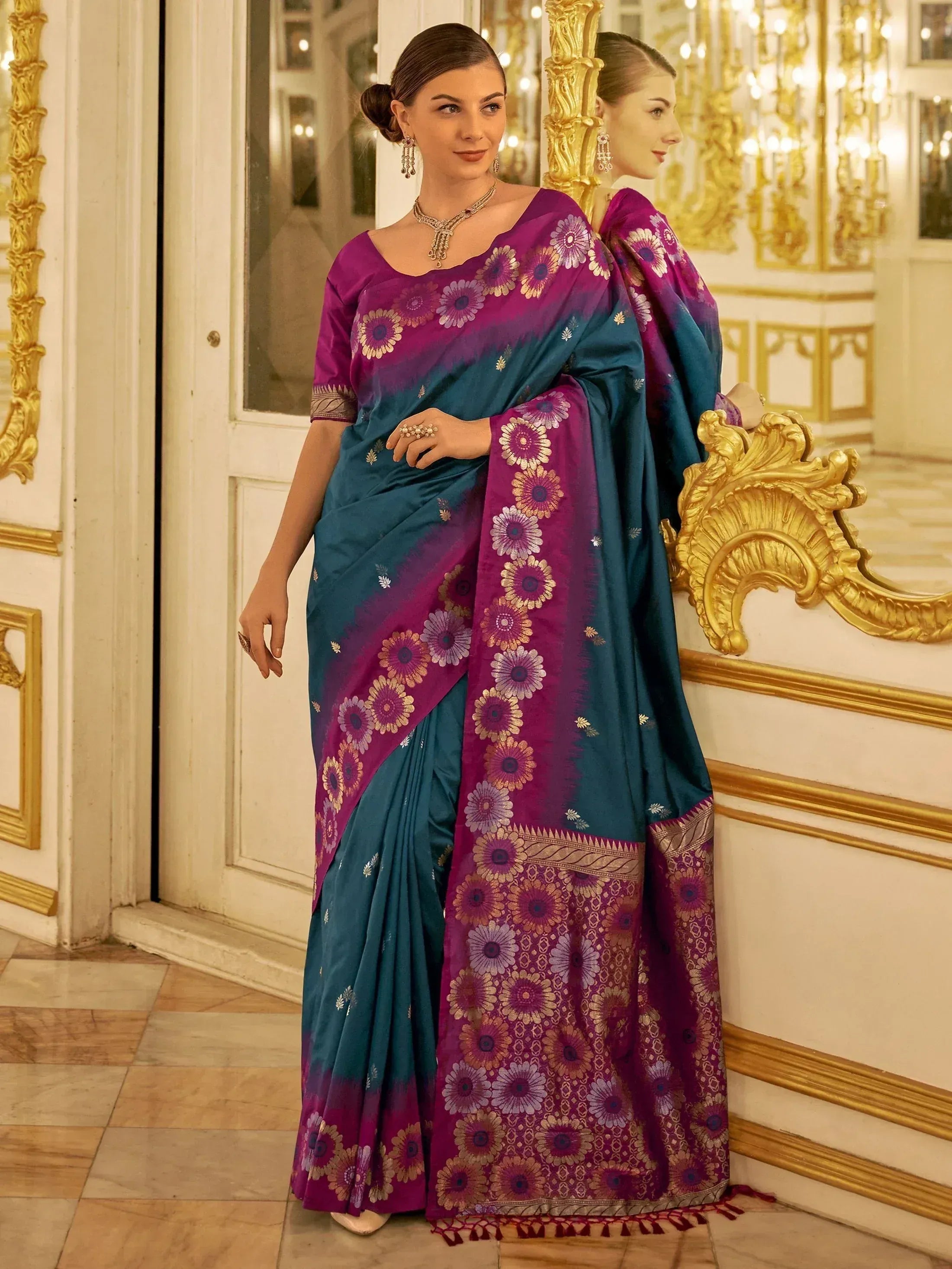 Woman in elegant purple and teal floral saree with gold embroidery, perfect for Indian ethnic occasions