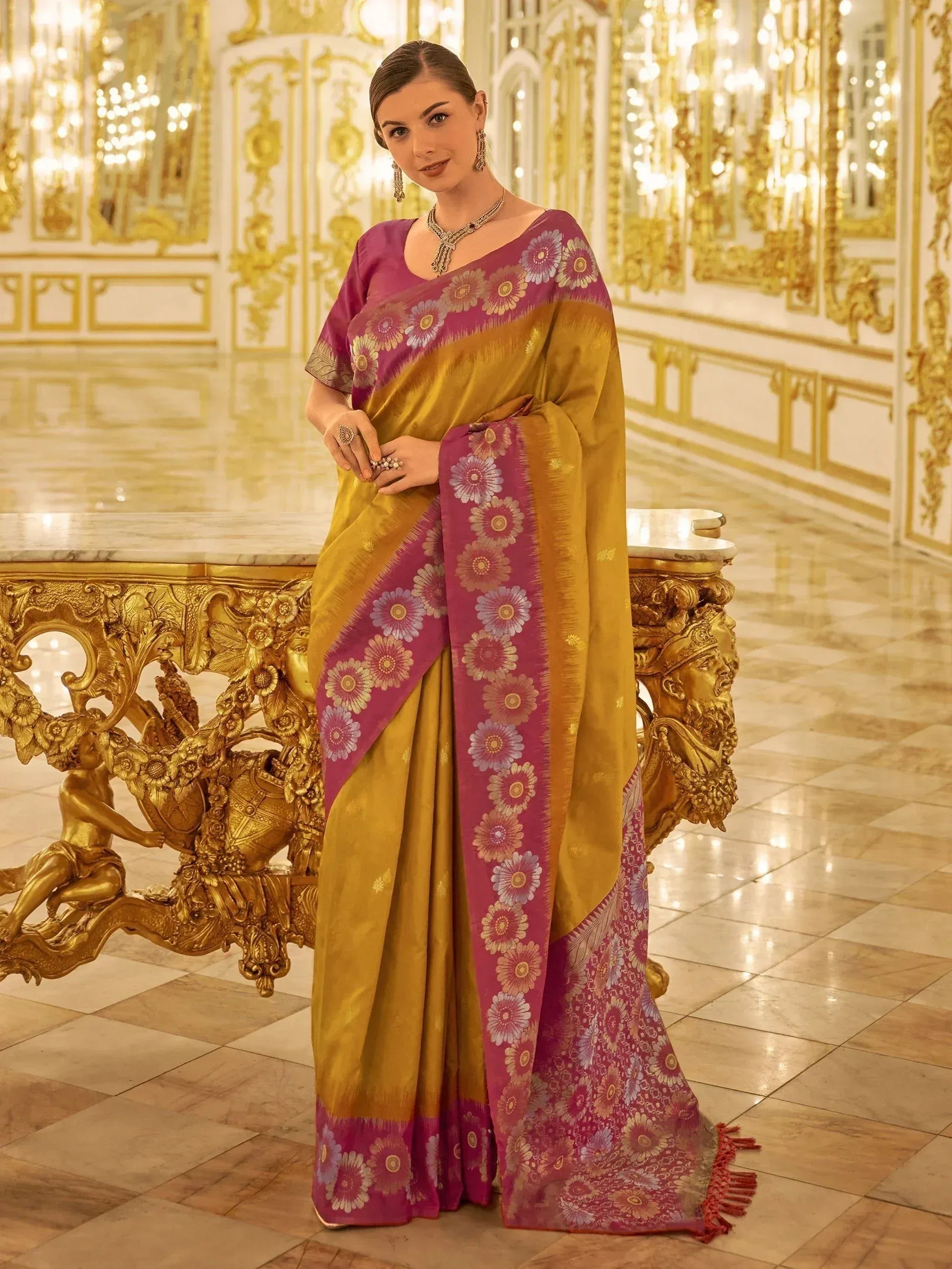 Elegant woman in golden and magenta floral saree with designer blouse, perfect for Indian ethnic occasions