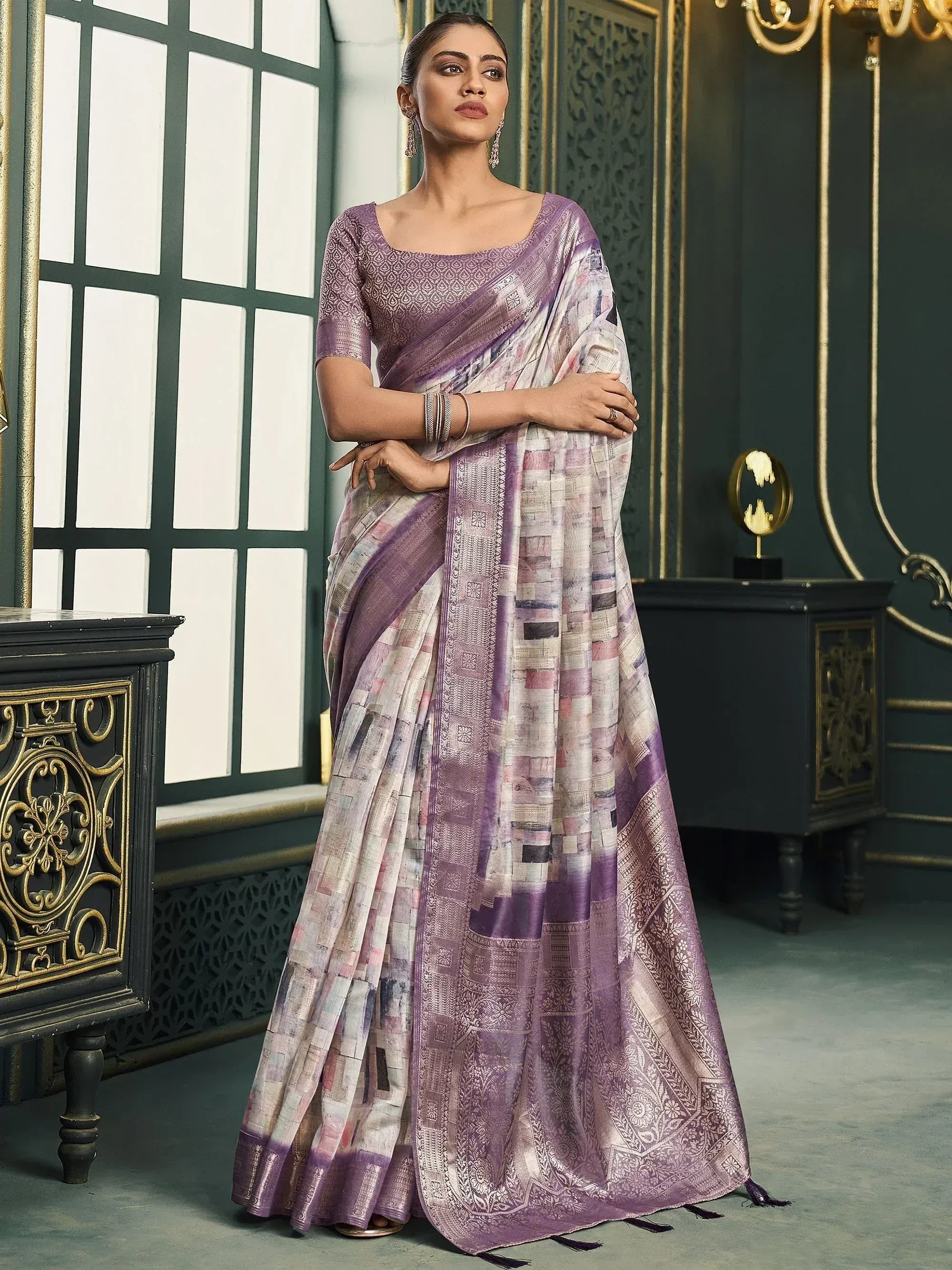 Purple printed saree with intricate border, paired with matching blouse, ideal for ethnic occasions