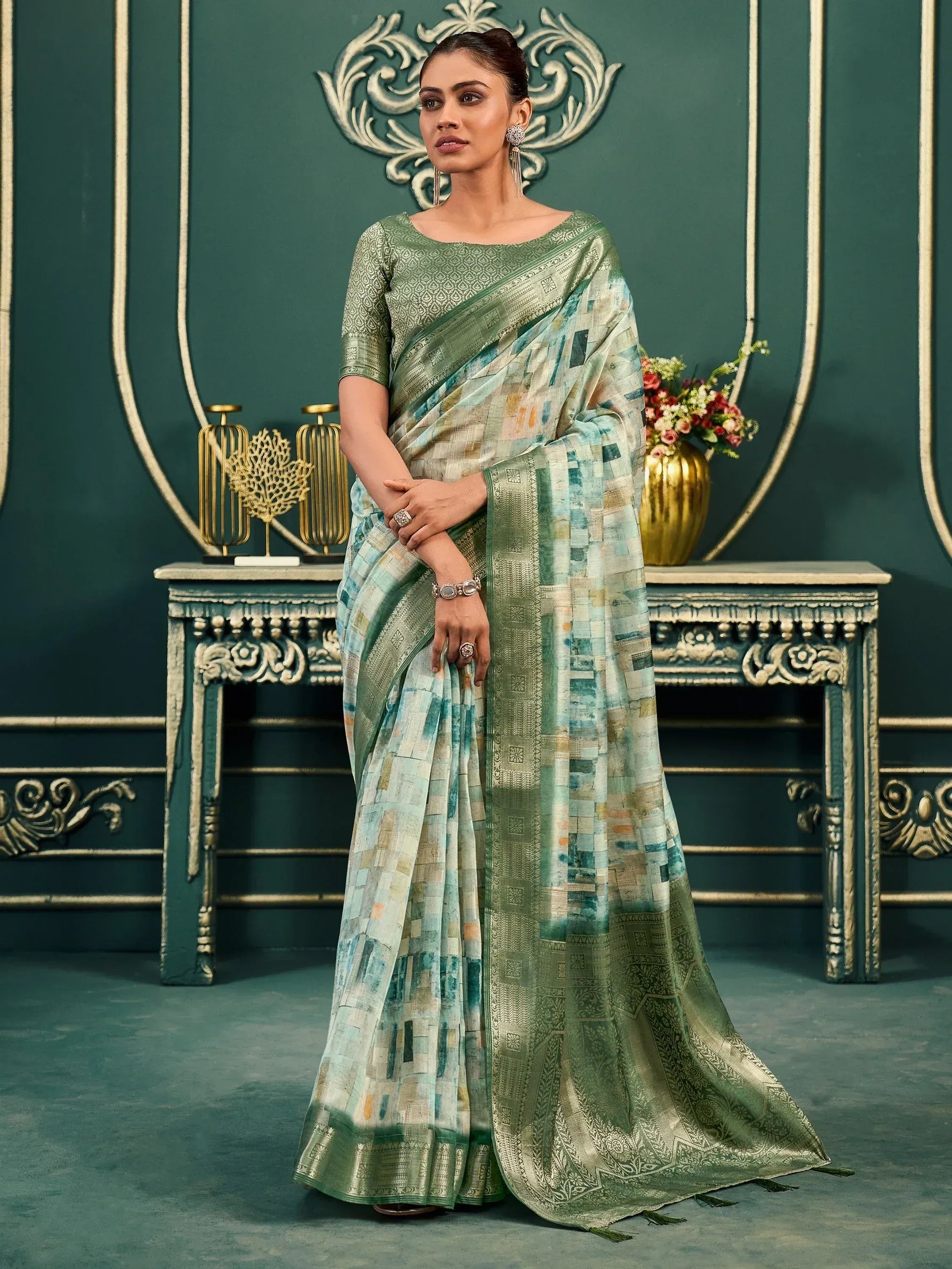 Elegant green printed saree with gold border, perfect for Indian ethnic wear occasions