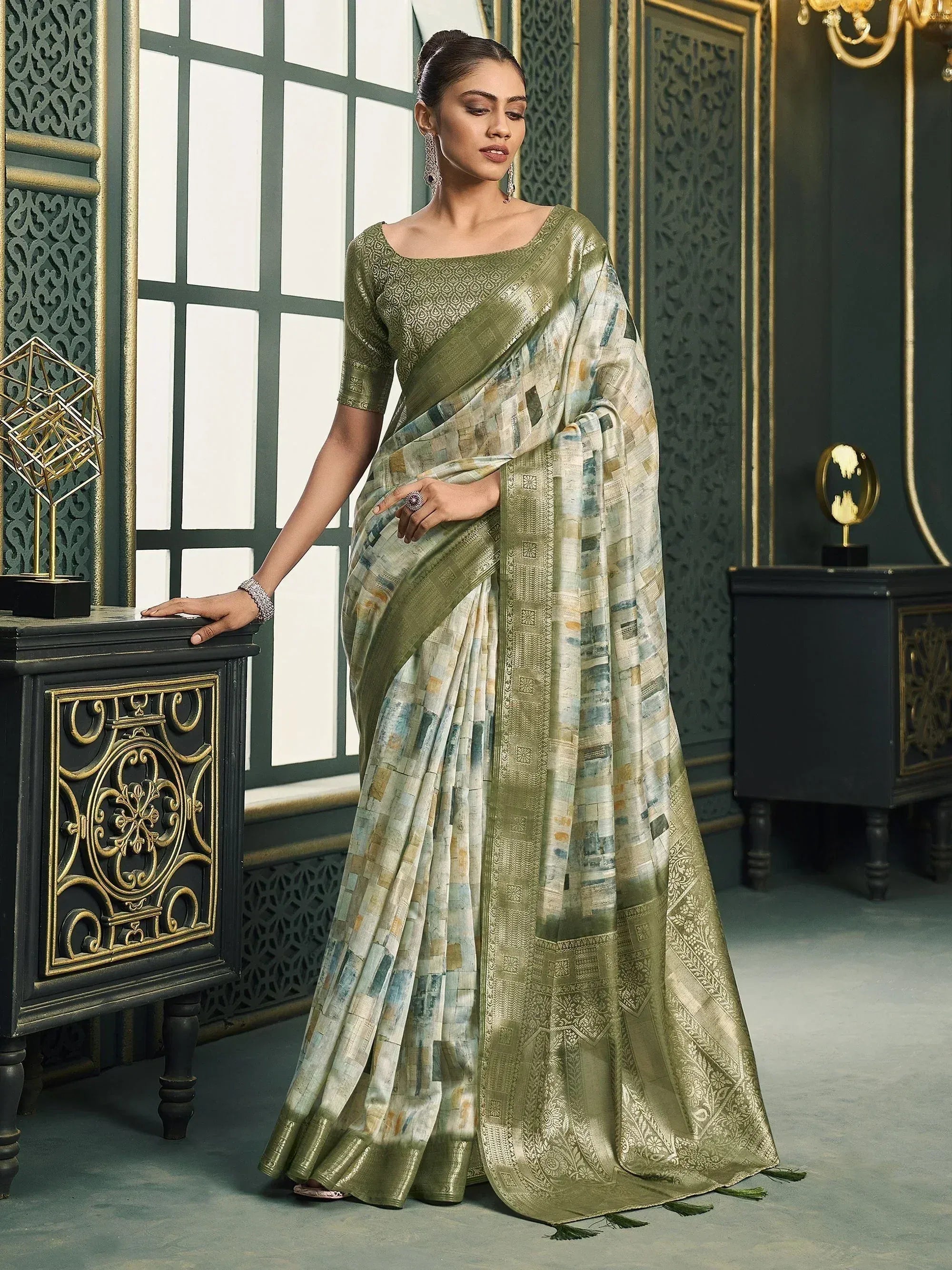 Elegant olive green designer saree with patchwork print and gold border, perfect for ethnic occasions
