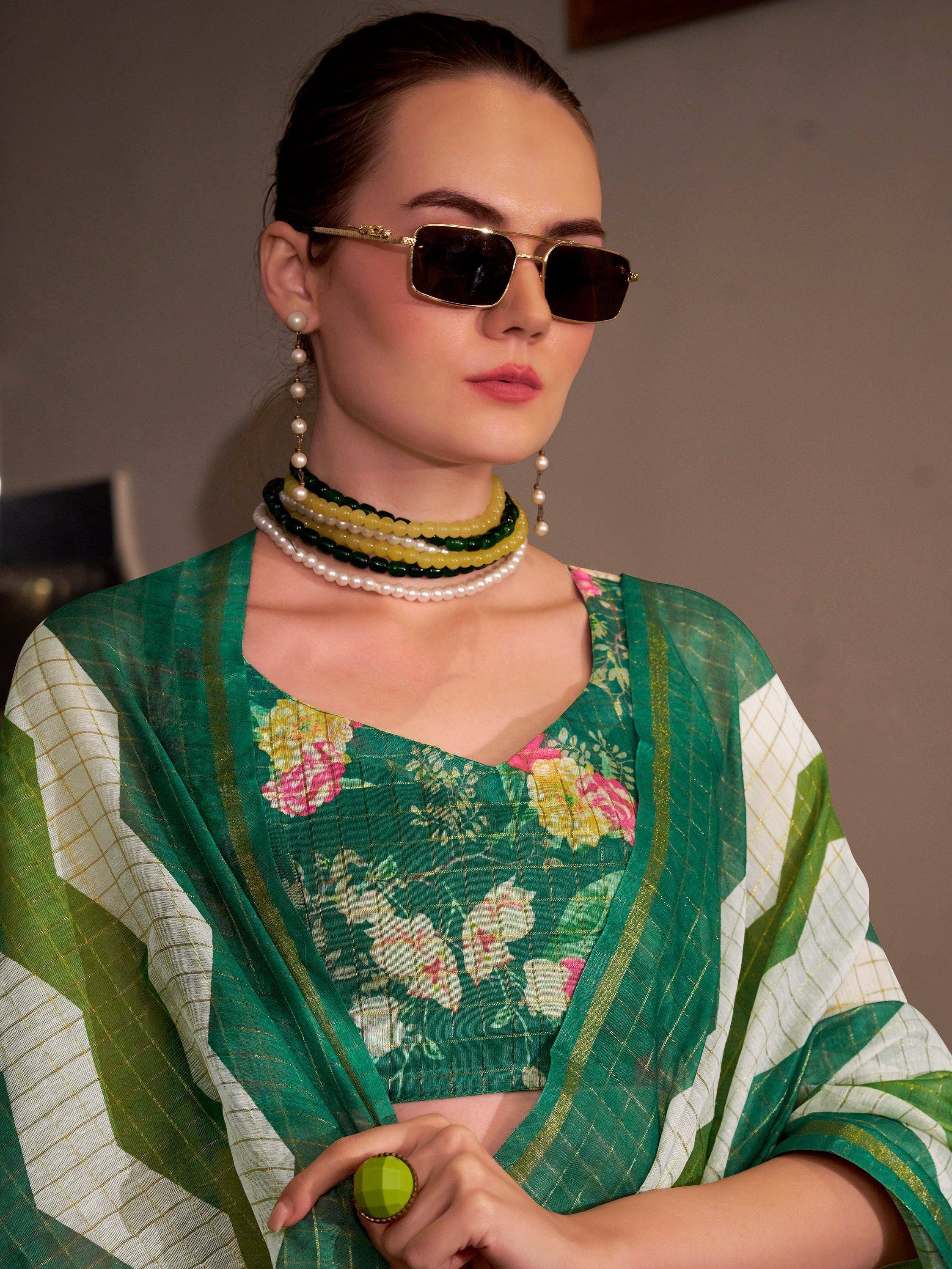 Green floral ethnic saree with pearl jewelry and sunglasses