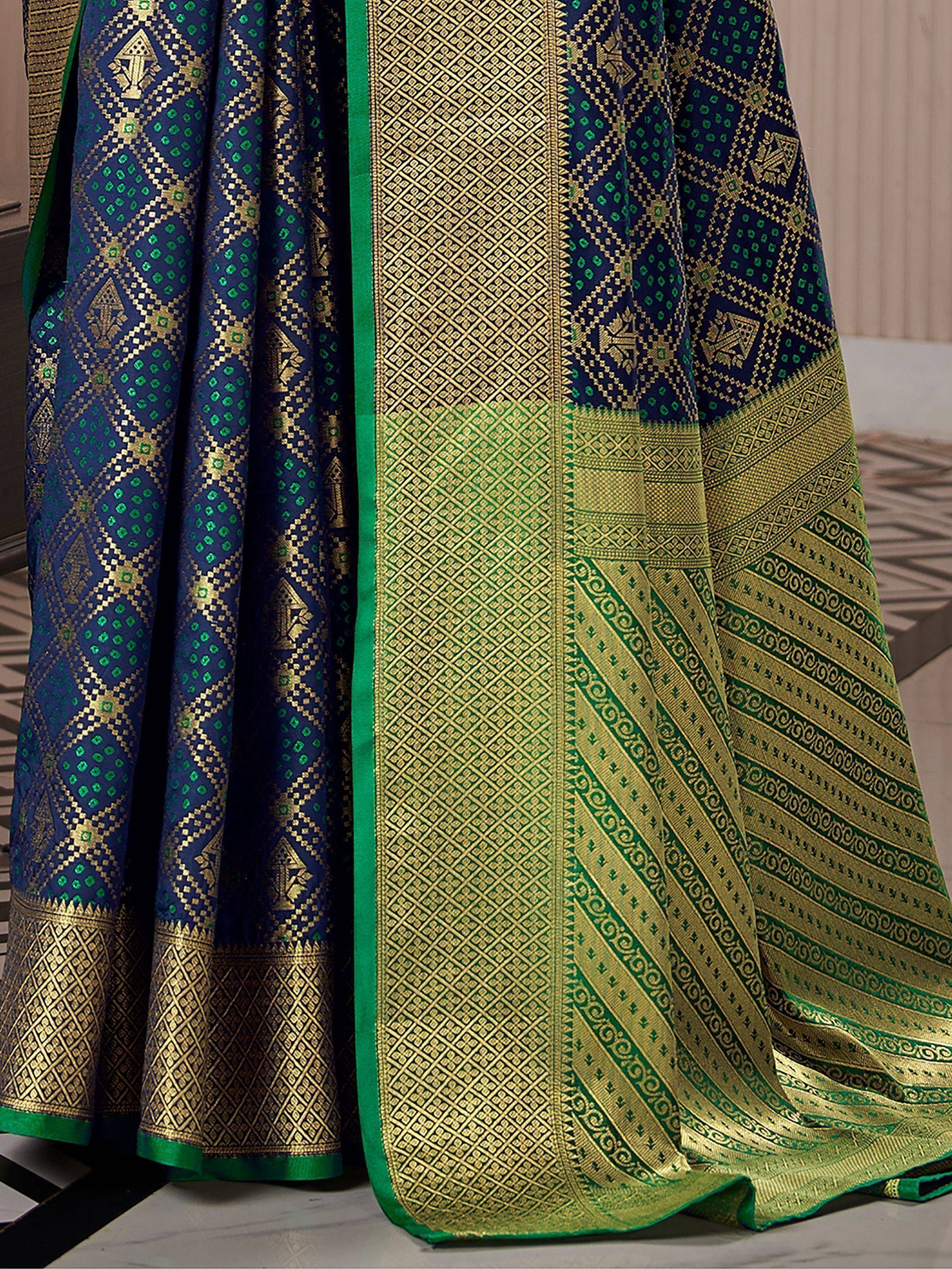 Blue and green designer saree with intricate gold patterns and border details