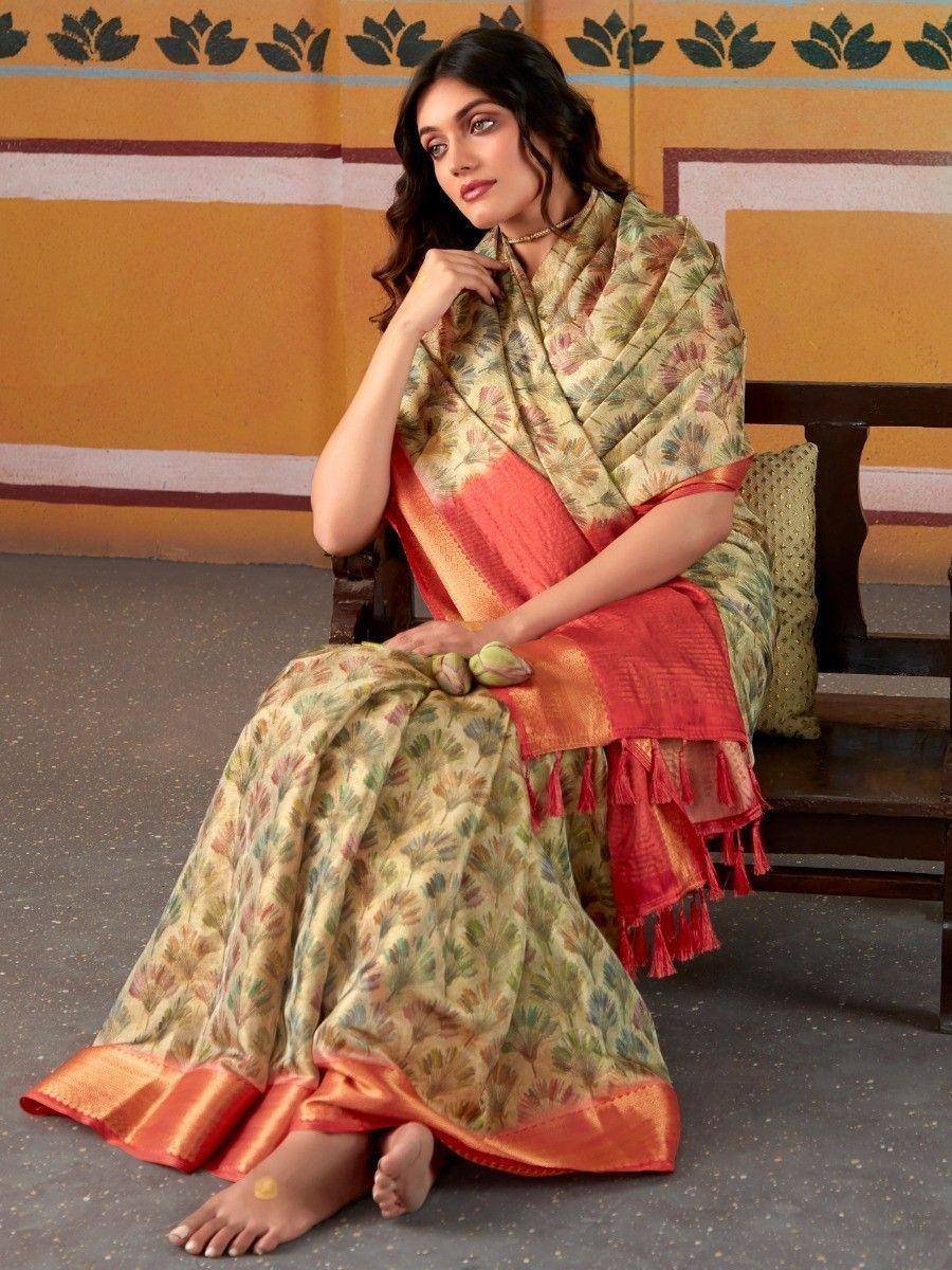 Woman in floral print saree with orange border, traditional Indian ethnic wear
