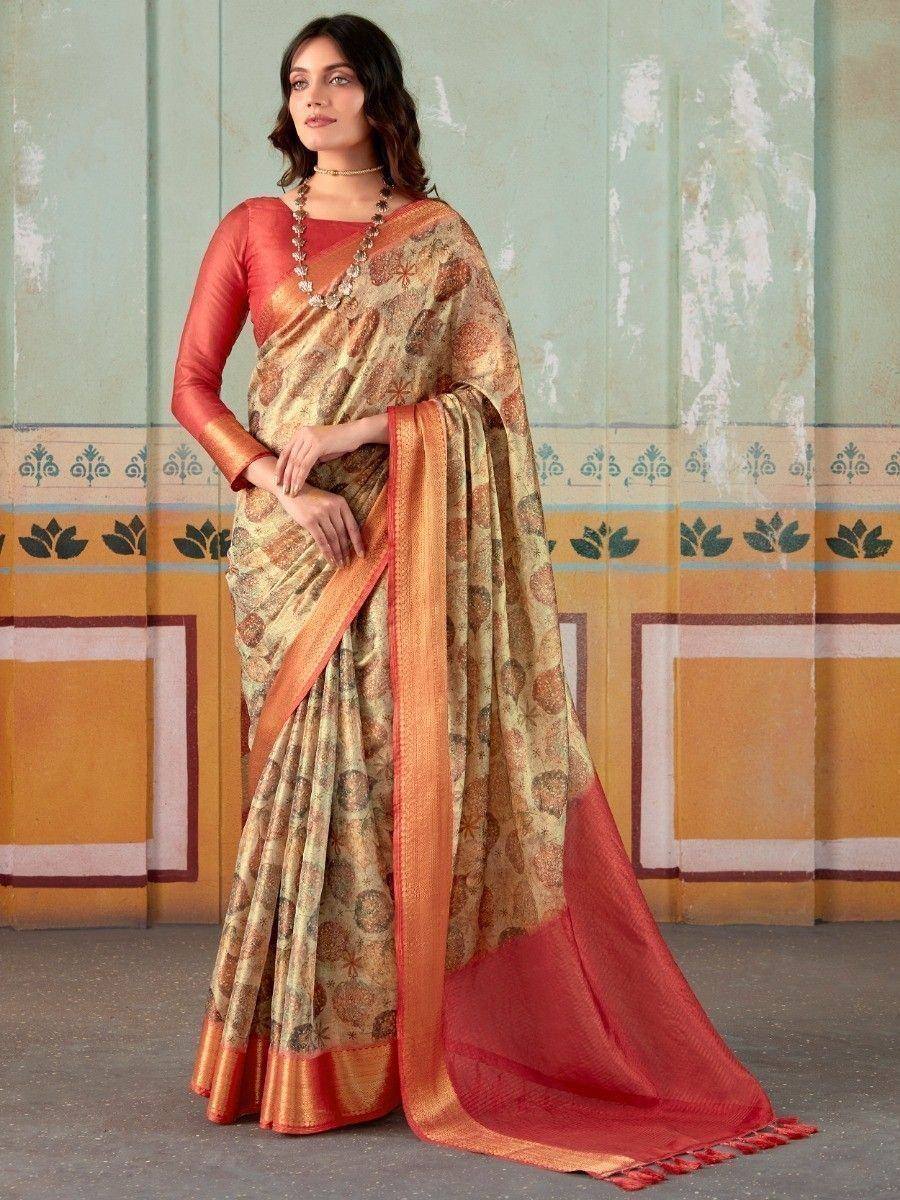 Elegant floral print saree with orange border and matching blouse, perfect for ethnic occasions