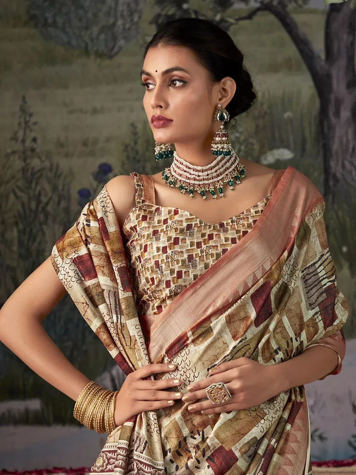Woman in elegant ethnic saree with geometric print, paired with traditional jewelry for festive occasions