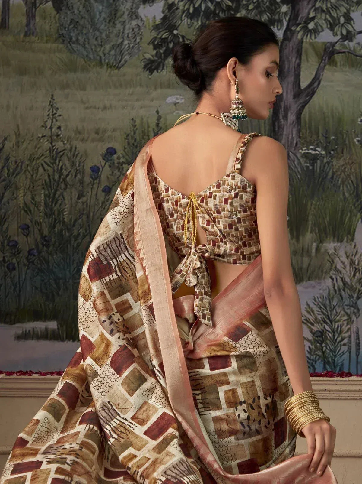 Elegant Indian saree with geometric print, back-tie blouse, and gold jewelry for ethnic wear