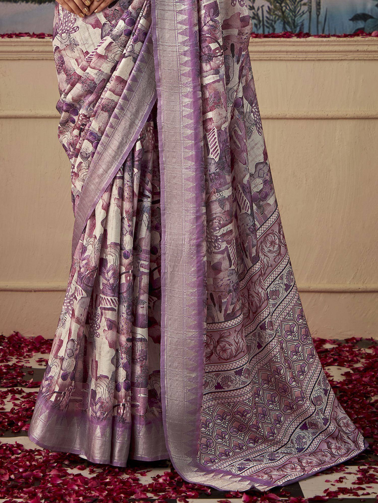 Purple and white printed saree with intricate floral patterns and border, styled for ethnic wear