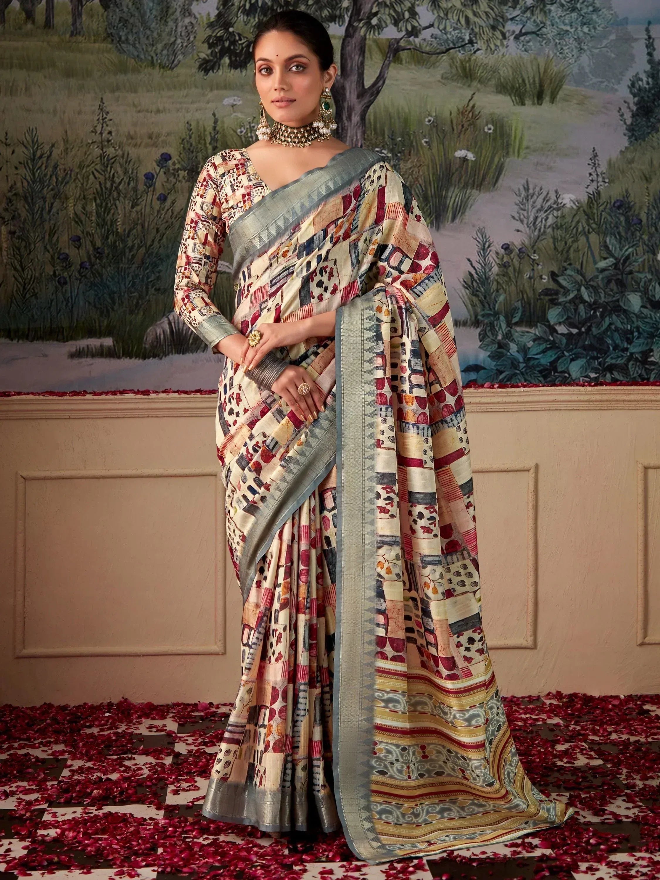 Woman in printed saree with geometric patterns, ethnic jewelry, standing on rose petals, Indian ethnic wear