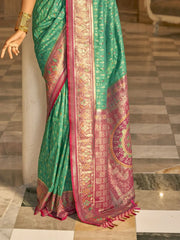 Captivating Teal Green Zari Weaving Banarasi Silk Event Wear Saree