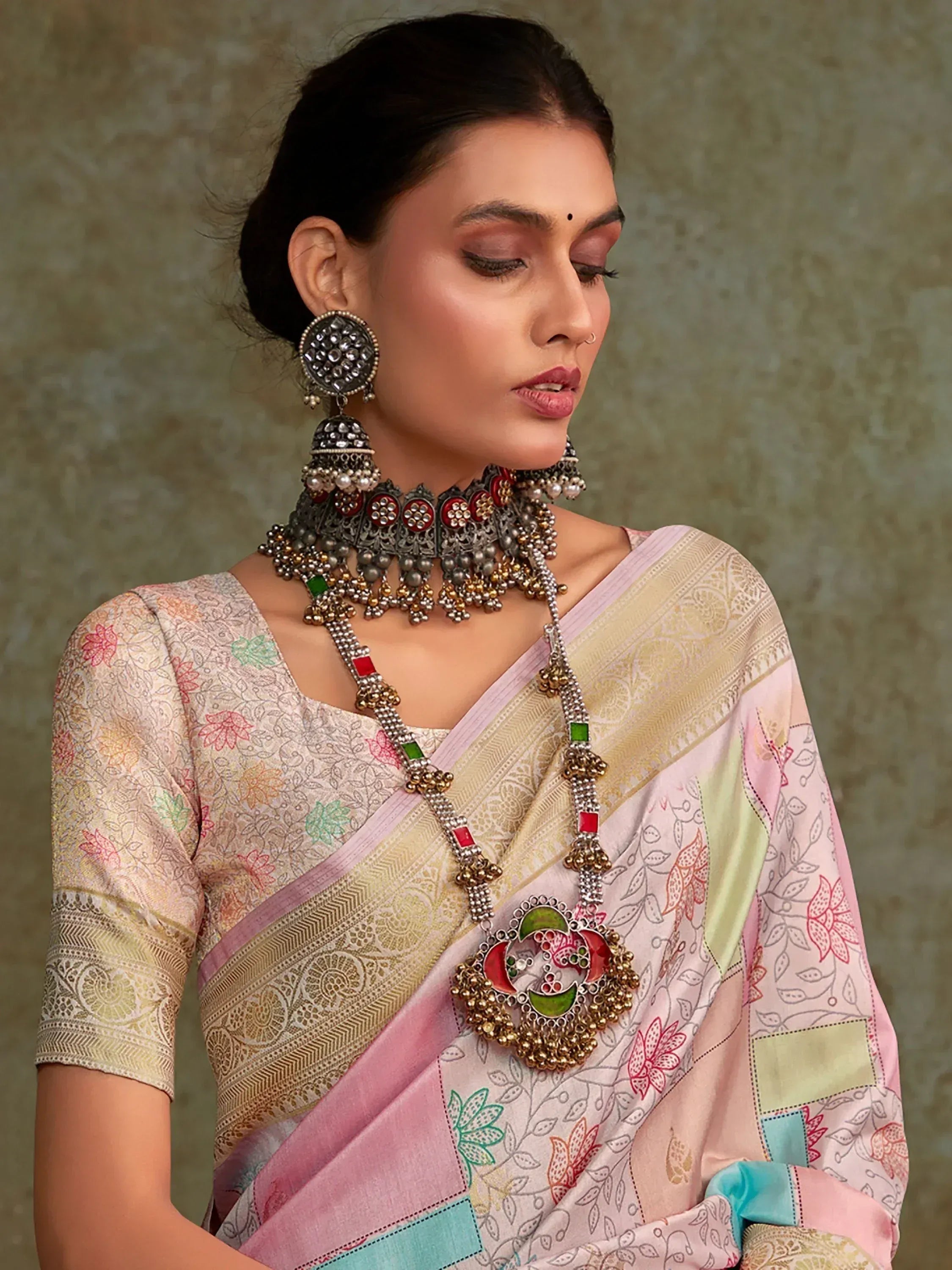 Woman in floral print saree with traditional Indian jewelry, ethnic wear