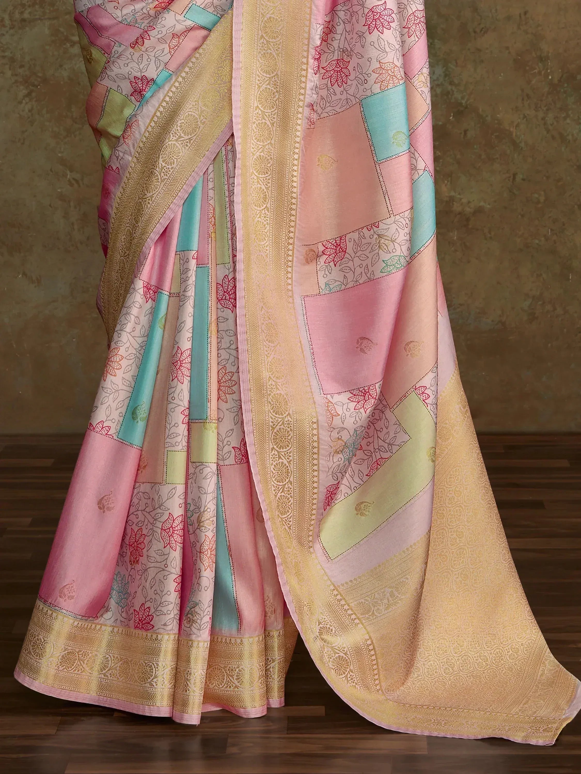 Pink and gold designer saree with floral patchwork and intricate border, perfect for ethnic occasions