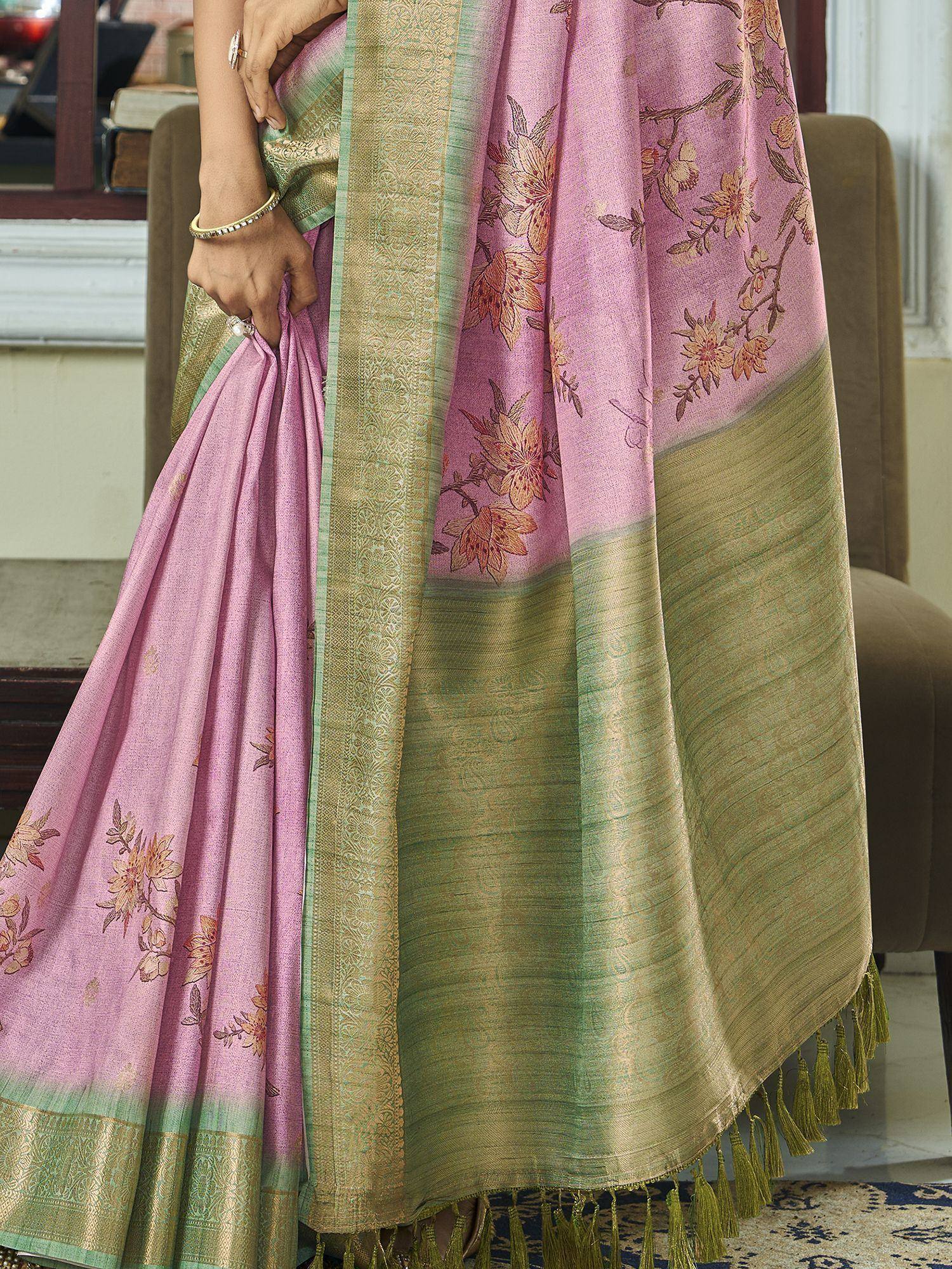 Pink floral saree with green border and tassels, elegant ethnic wear design