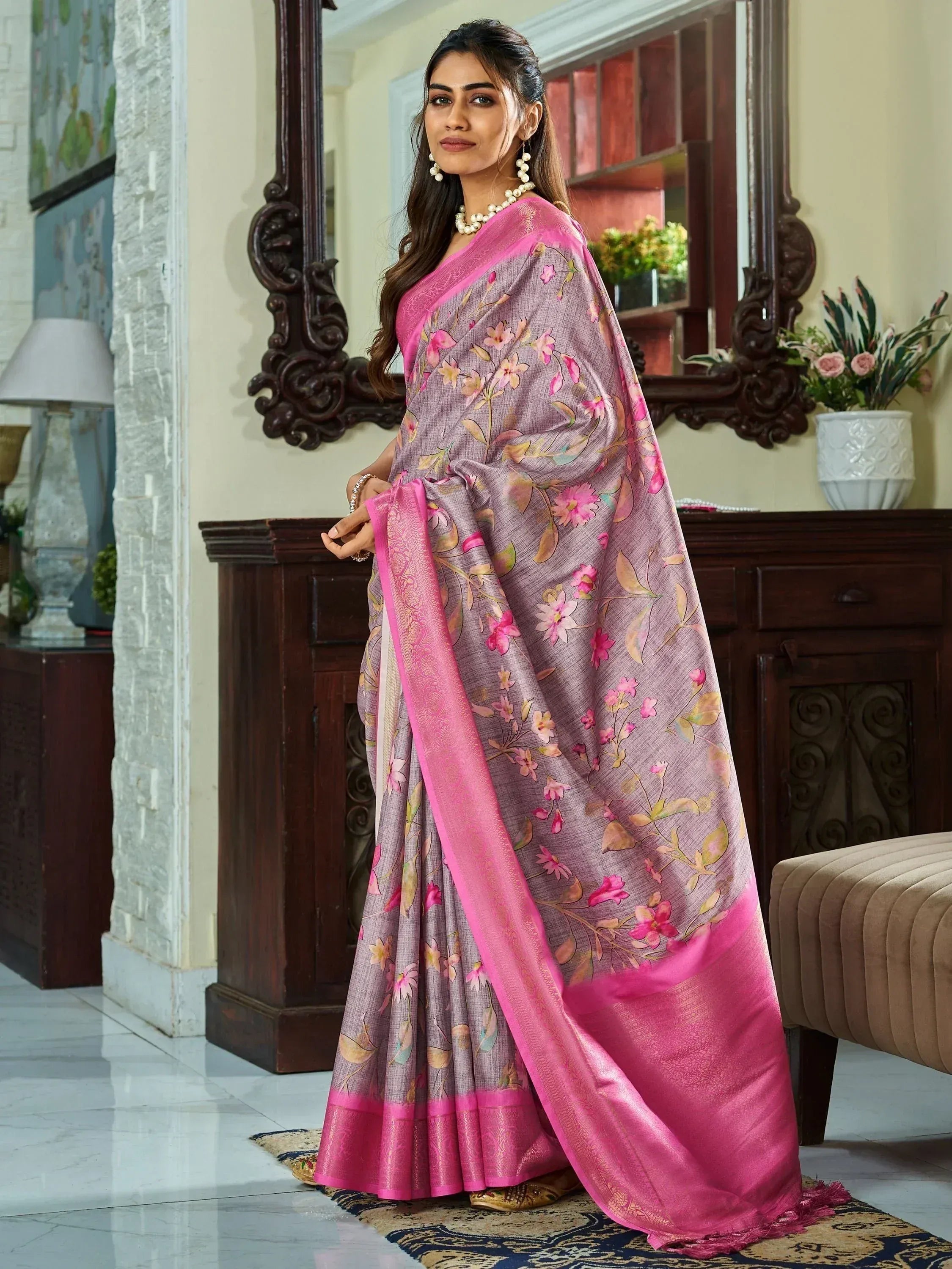 Elegant floral saree with pink border, perfect for Indian ethnic wear occasions