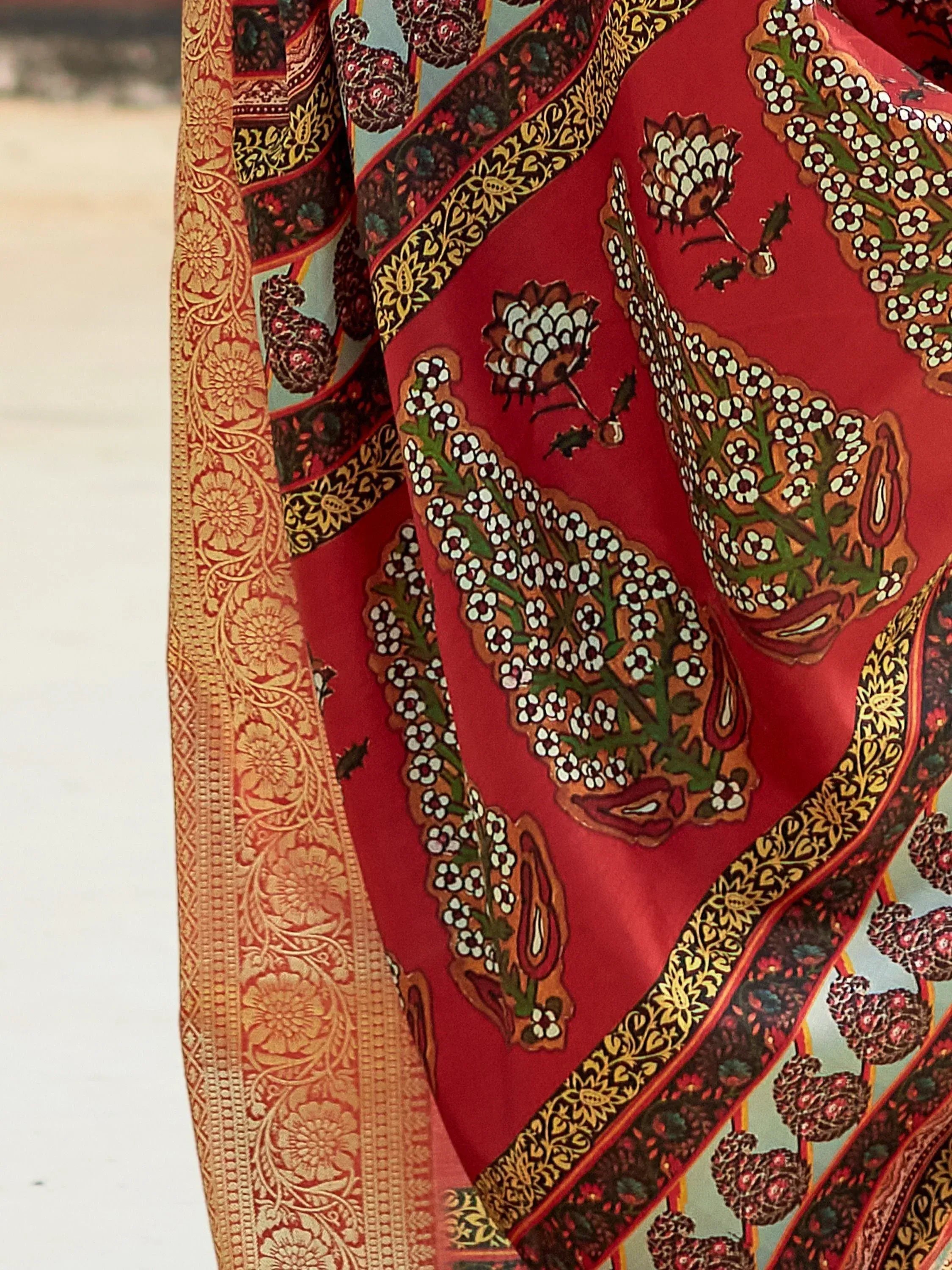 Red floral paisley saree with golden border, perfect for Indian ethnic wear