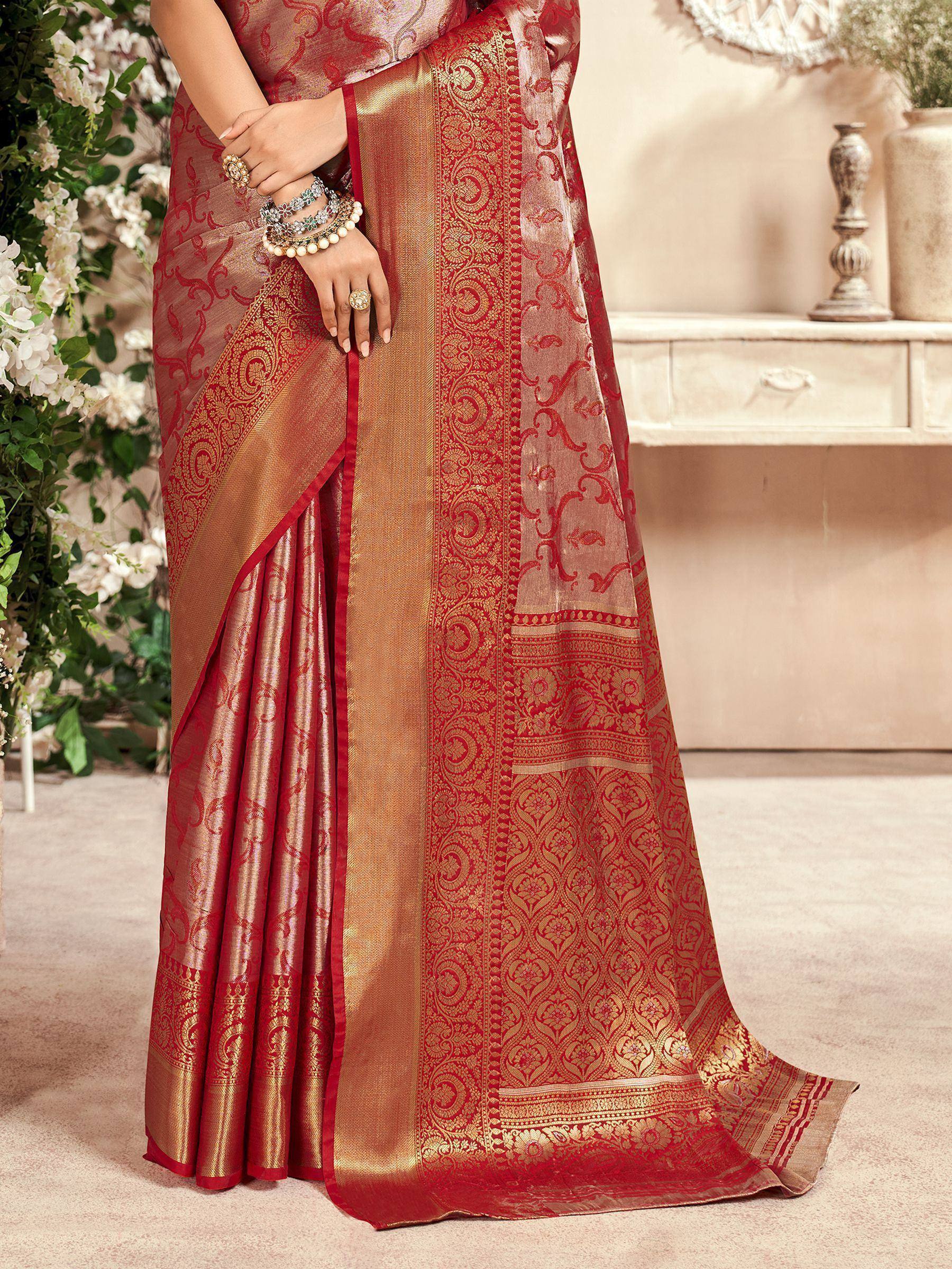 Red and gold designer saree with intricate paisley and floral motifs, perfect for Indian ethnic wear occasions