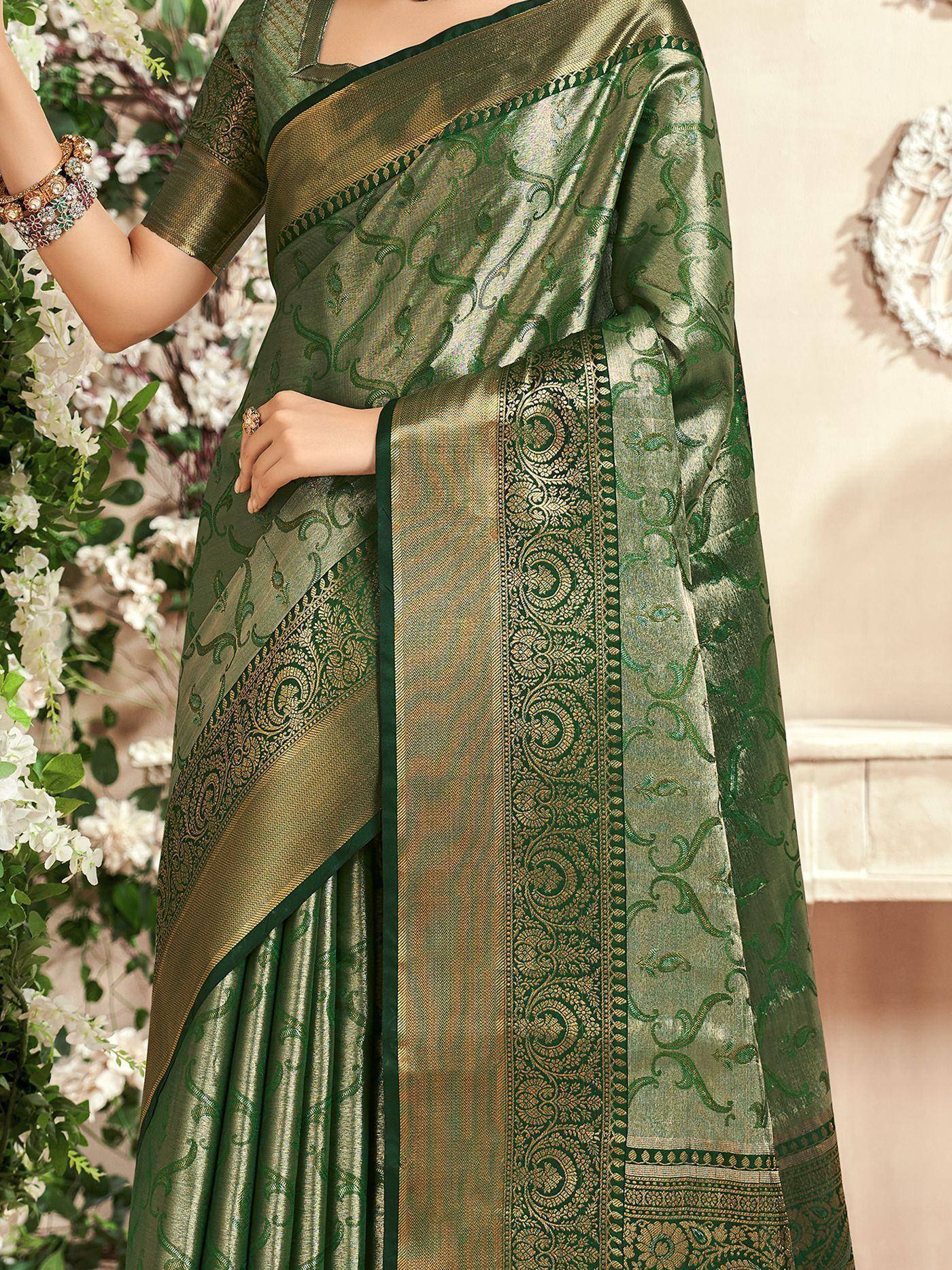 Elegant green designer saree with intricate gold paisley patterns and border, perfect for ethnic occasions