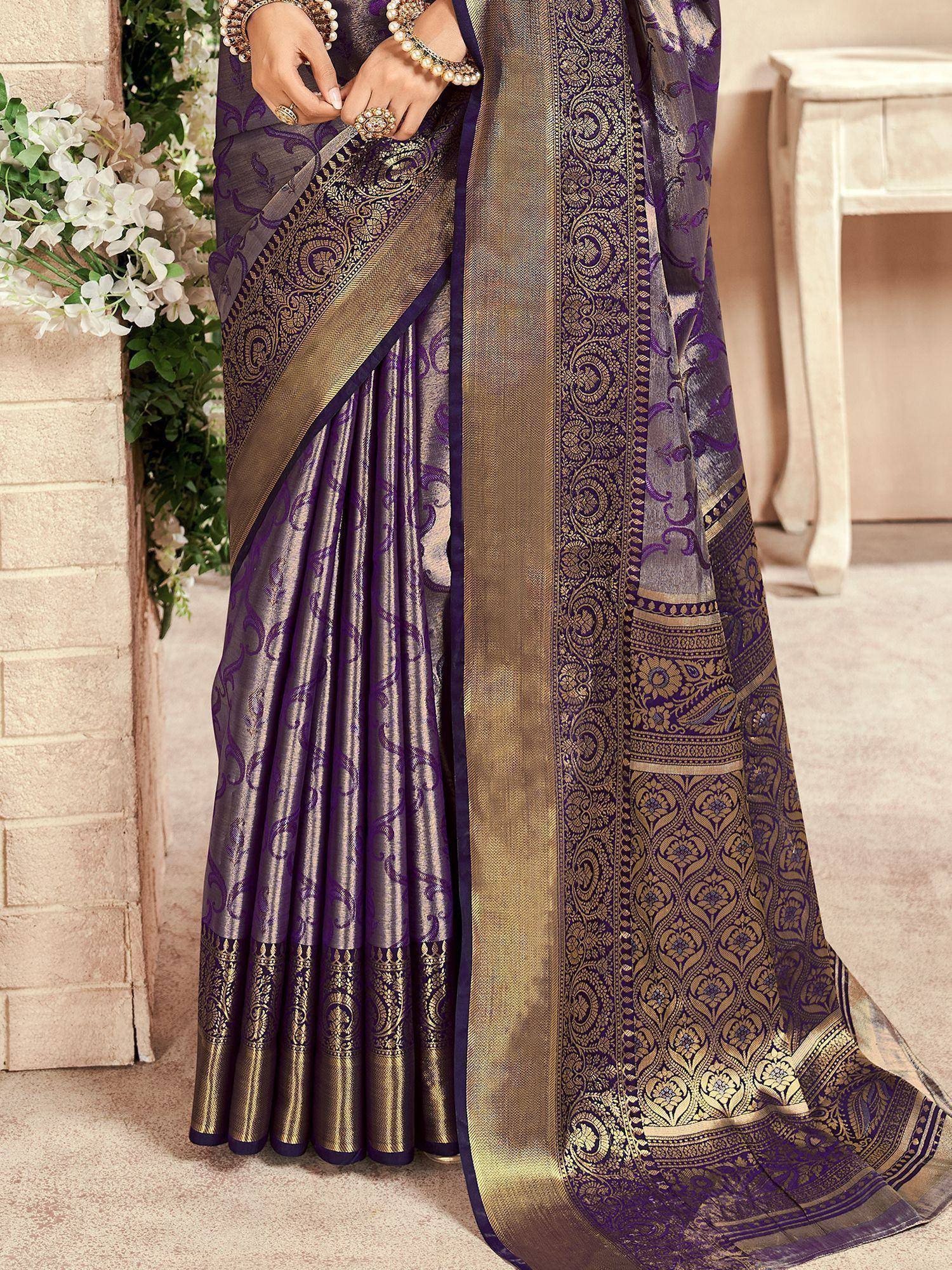 Purple and gold designer saree with intricate paisley and floral motifs, perfect for ethnic occasions