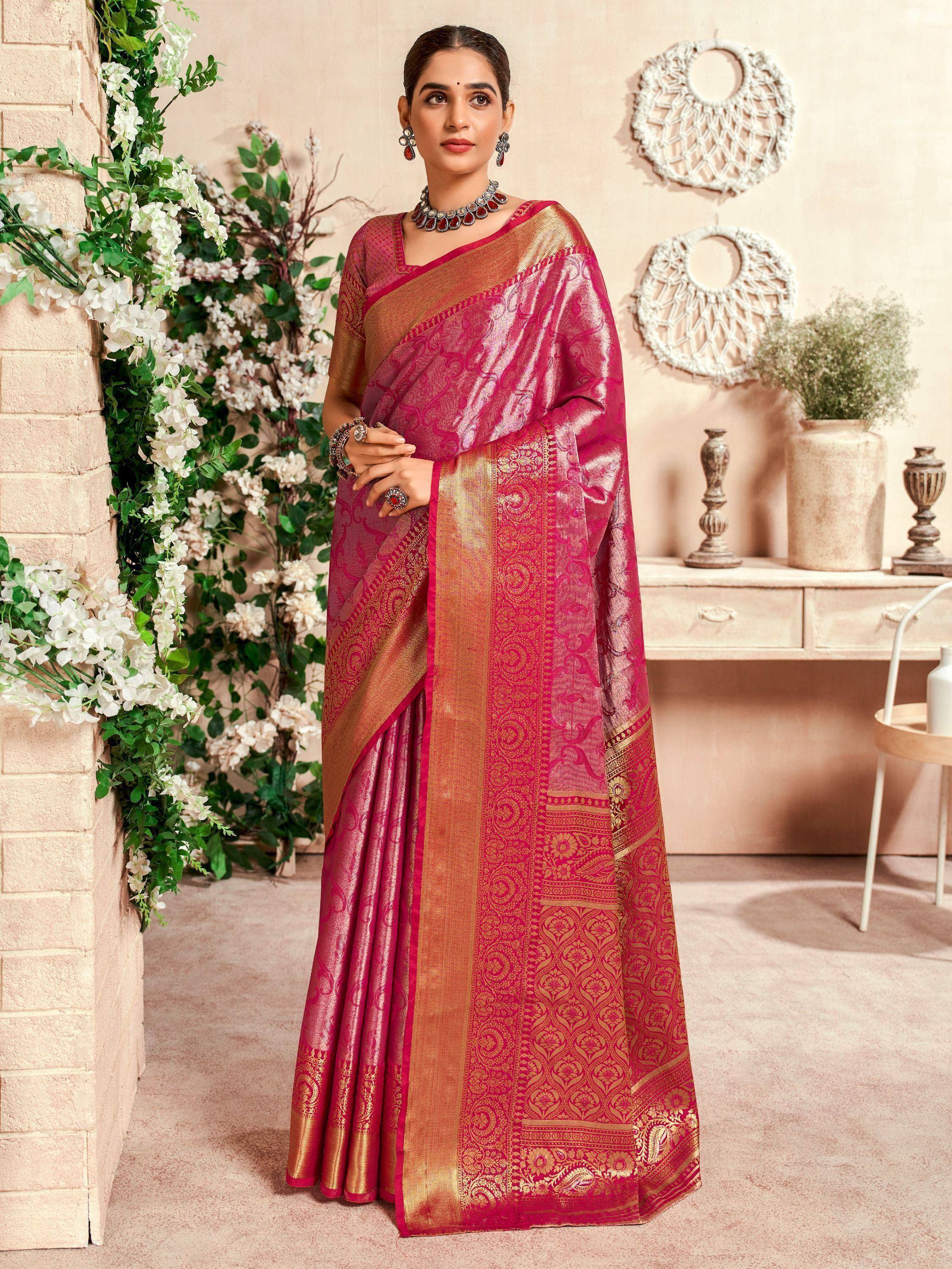 Elegant pink and gold designer saree with intricate woven patterns, perfect for Indian ethnic occasions