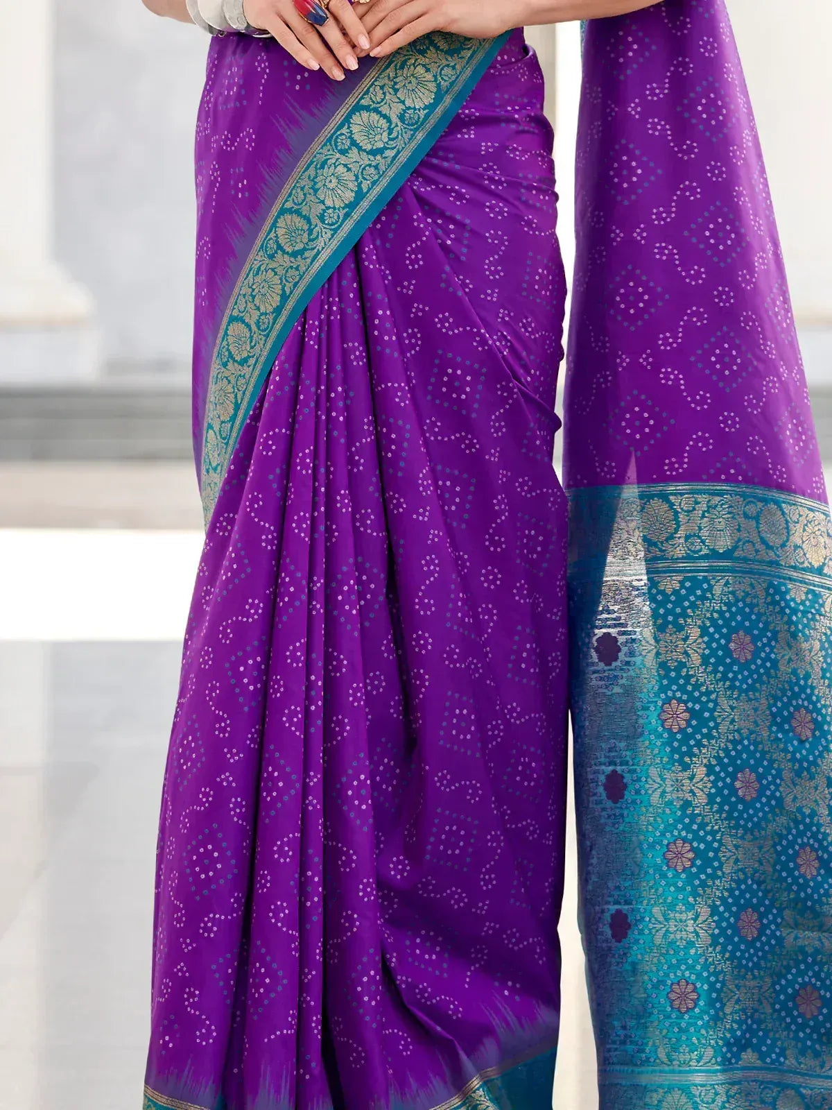 Purple ethnic saree with teal floral border, perfect for Indian occasions and festive wear