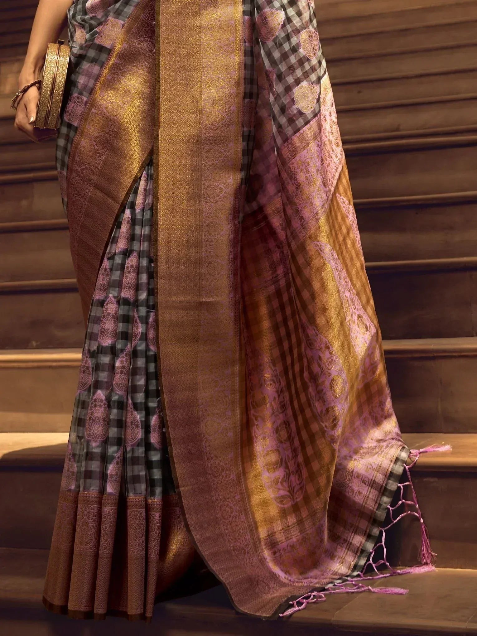 Elegant purple and gold checkered saree with intricate border, perfect for Indian ethnic wear occasions.