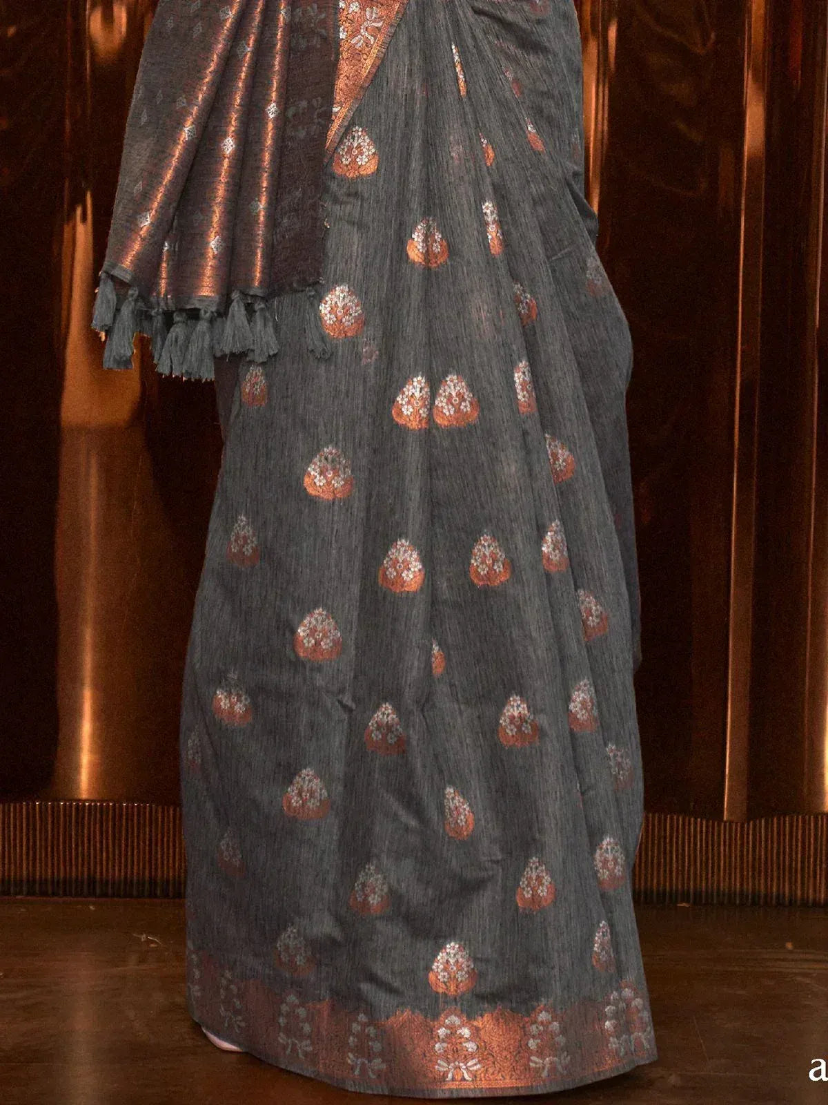 Grey saree with copper floral motifs and tassel border, ethnic Indian wear