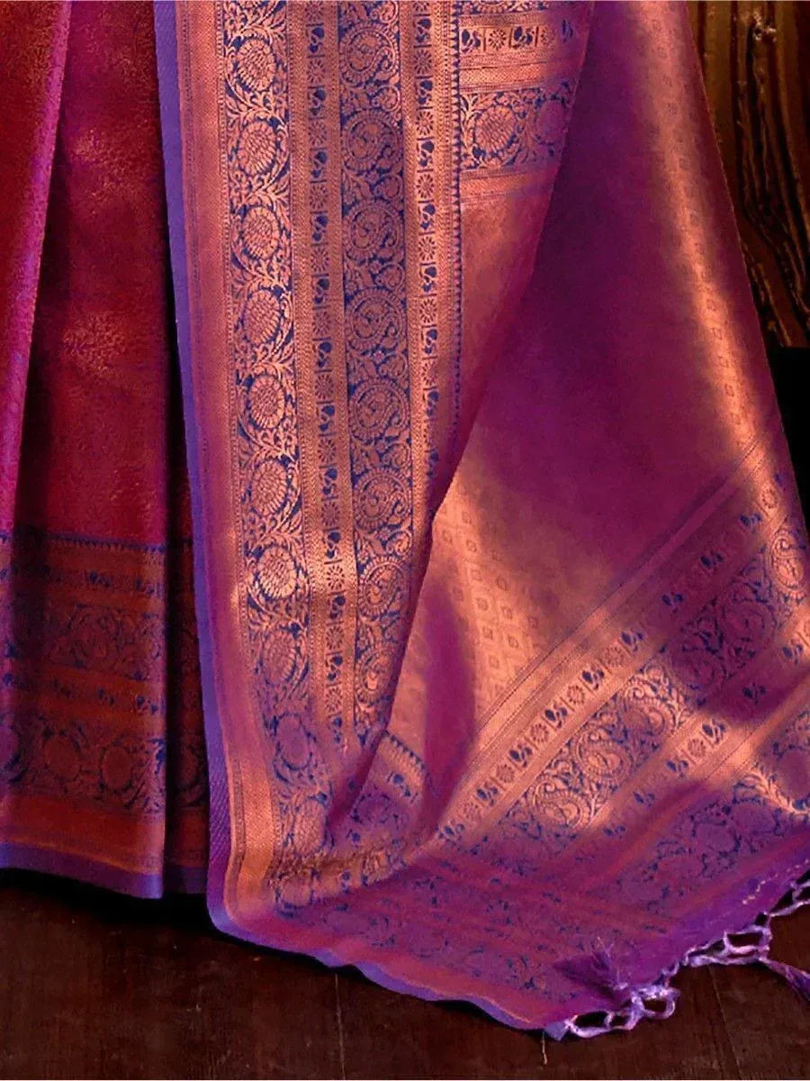 Rich purple and gold embroidered saree with intricate paisley border, perfect for ethnic occasions