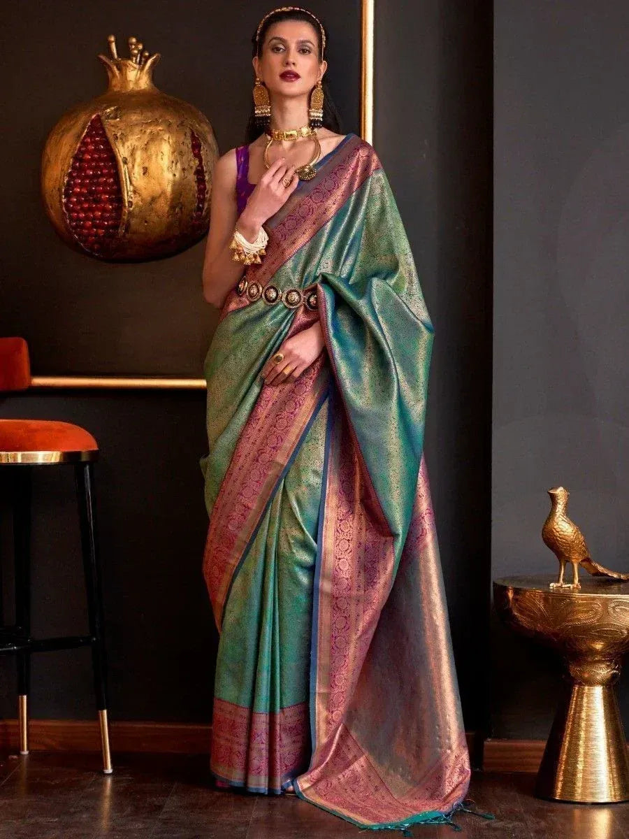 Elegant green and pink silk saree with gold border, perfect for Indian ethnic wear and festive occasions.