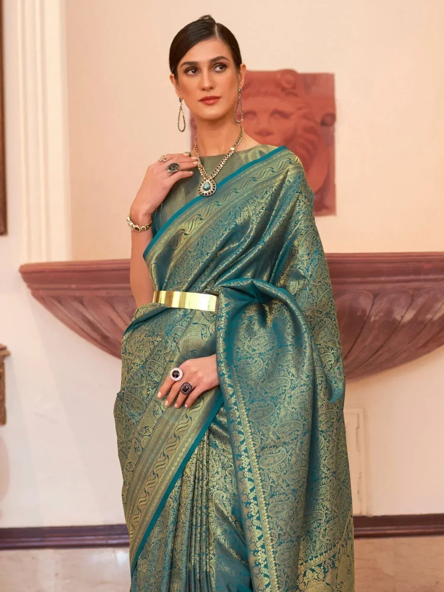 Teal and gold designer saree with intricate paisley weave, perfect for Indian ethnic wear occasions