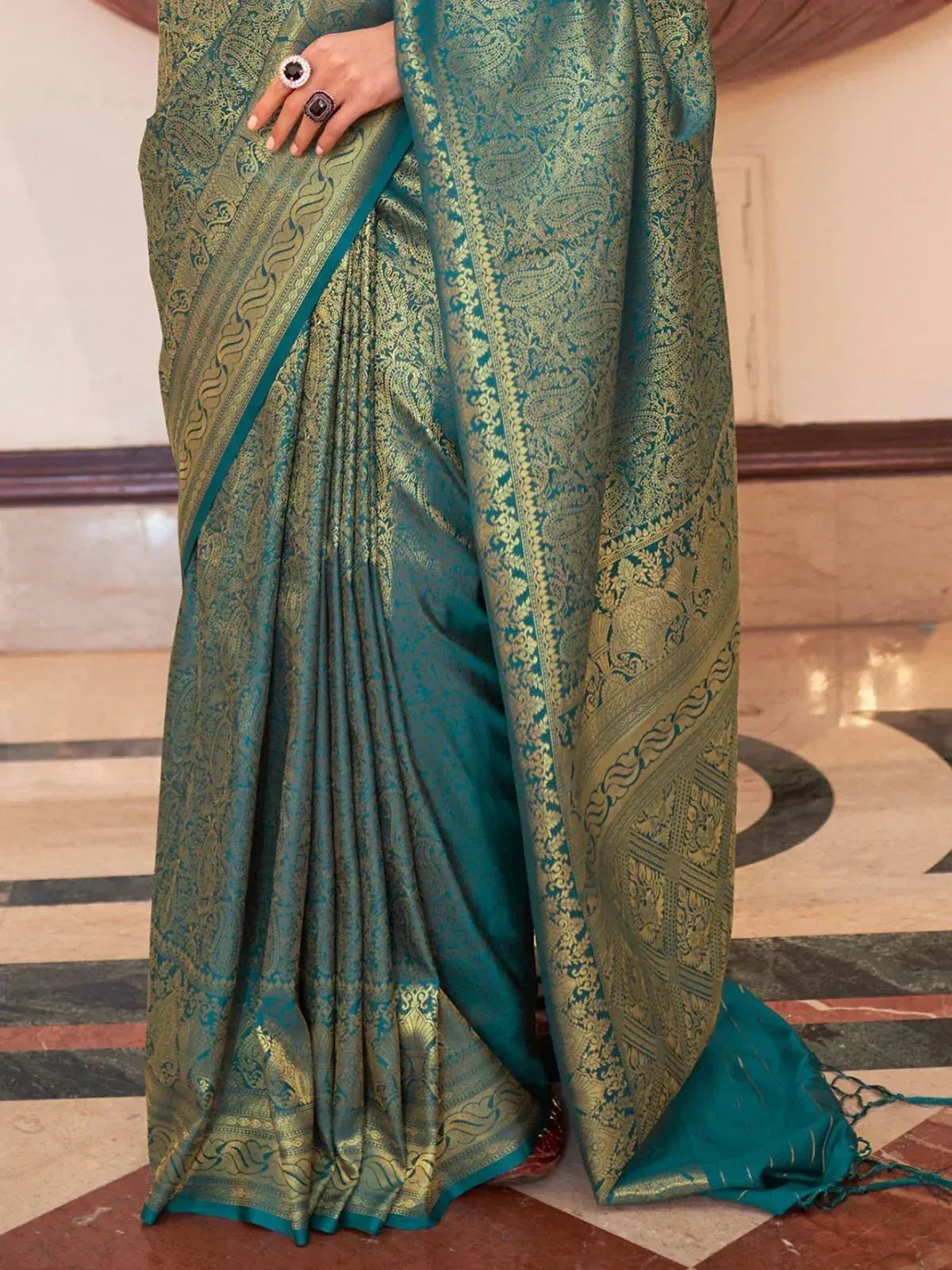 Teal and gold designer saree with intricate paisley weave, perfect for ethnic occasions