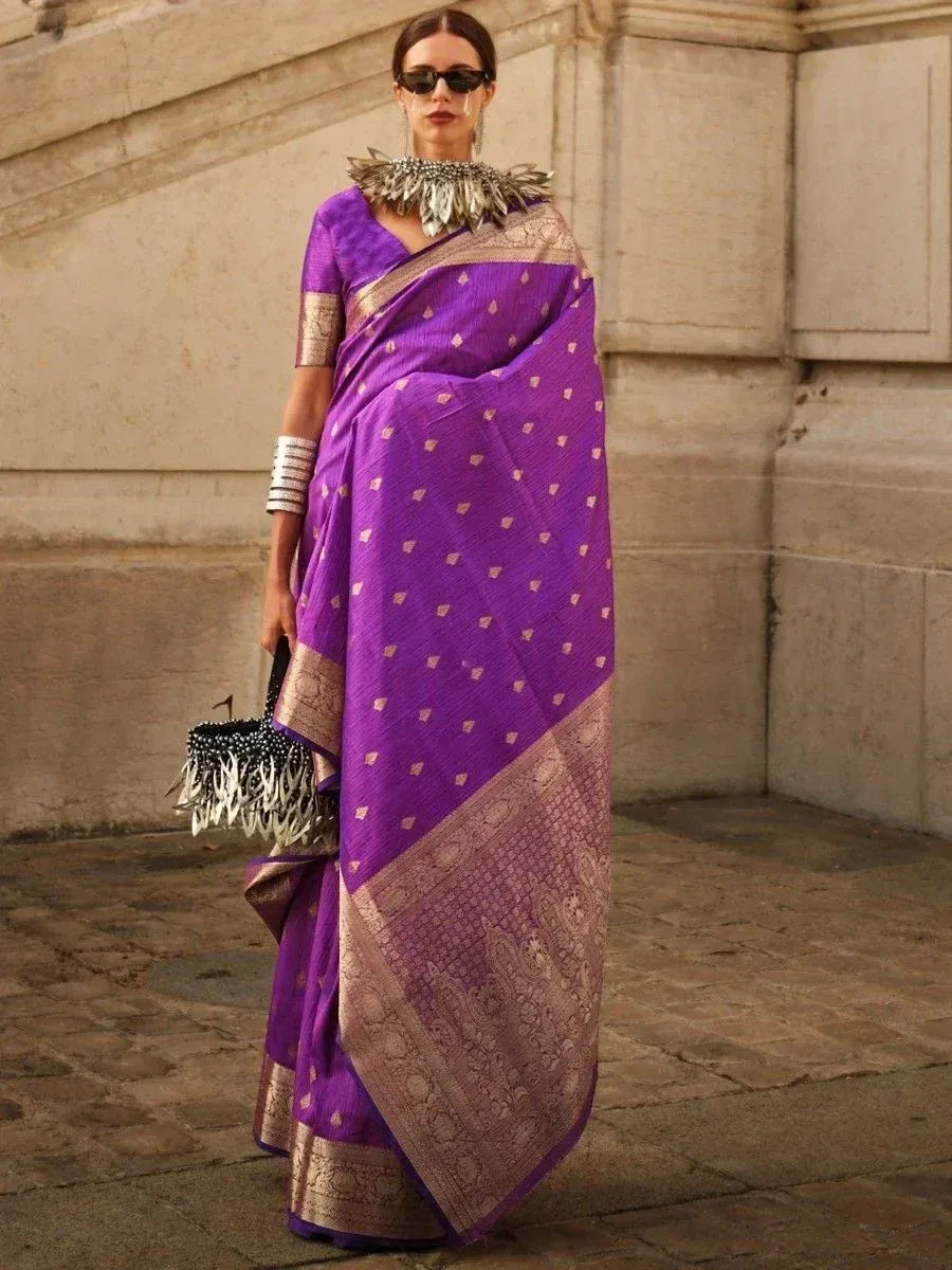Purple ethnic saree with gold motifs and border, styled with statement jewelry for Indian wear