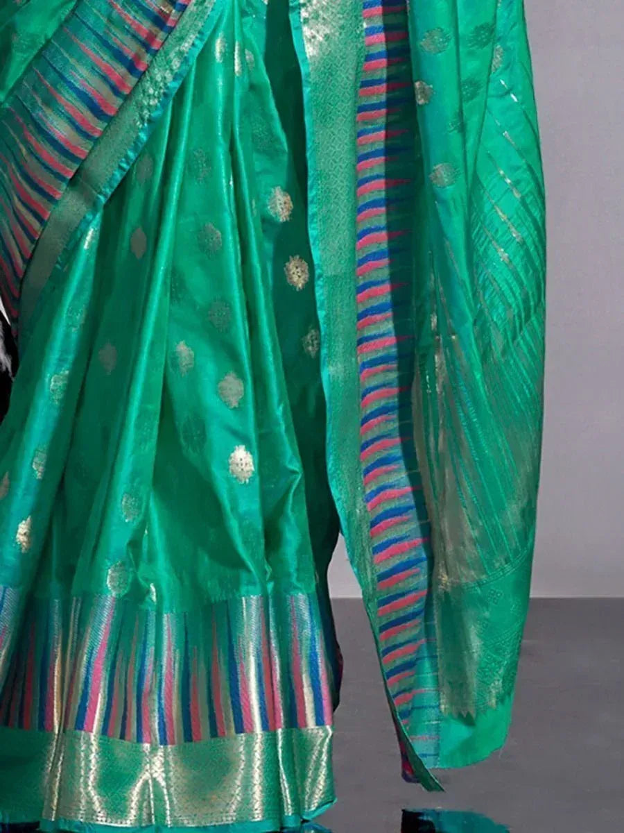 Emerald green silk saree with gold motifs and colorful striped border, ideal for Indian ethnic wear