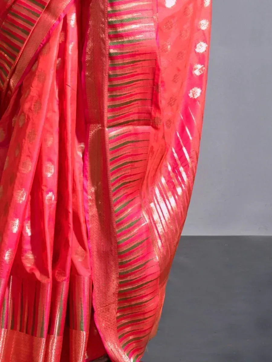 Vibrant red ethnic saree with gold motifs and green border, perfect for Indian occasions
