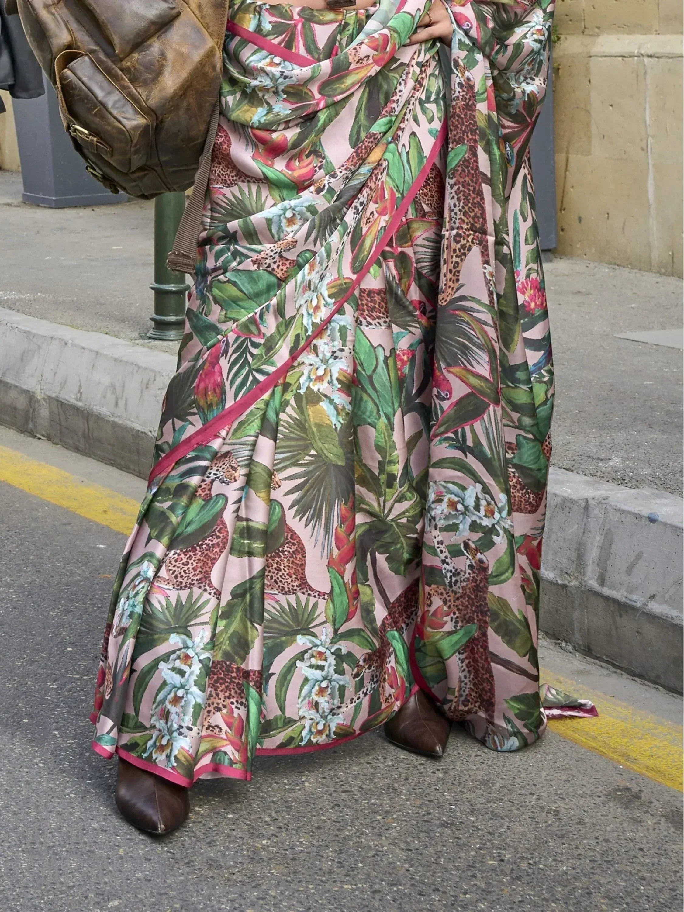 Tropical print saree with leopard, flowers, and green leaves, styled with brown boots and bag