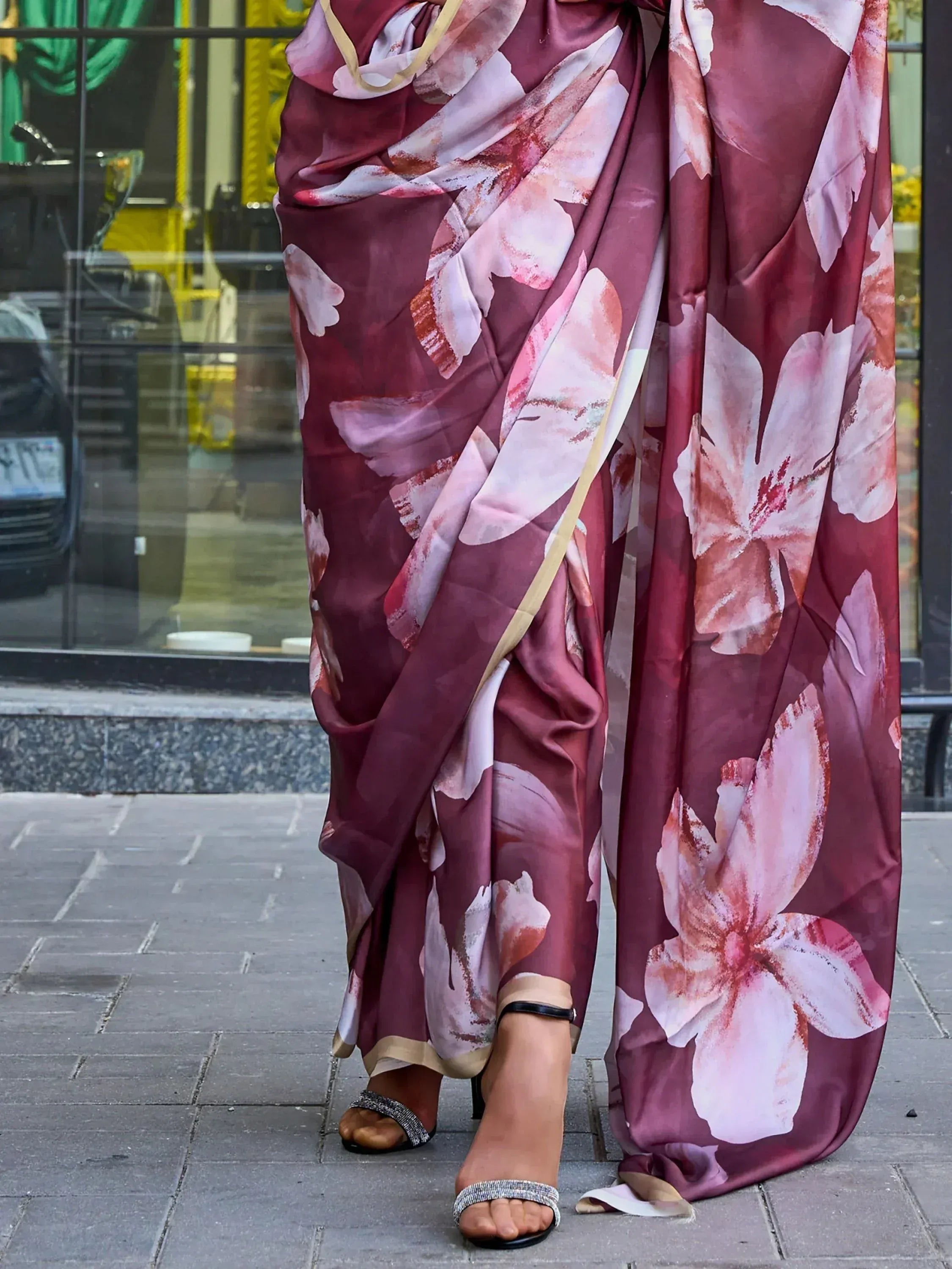 Maroon floral print saree with gold border, styled with heels for ethnic wear