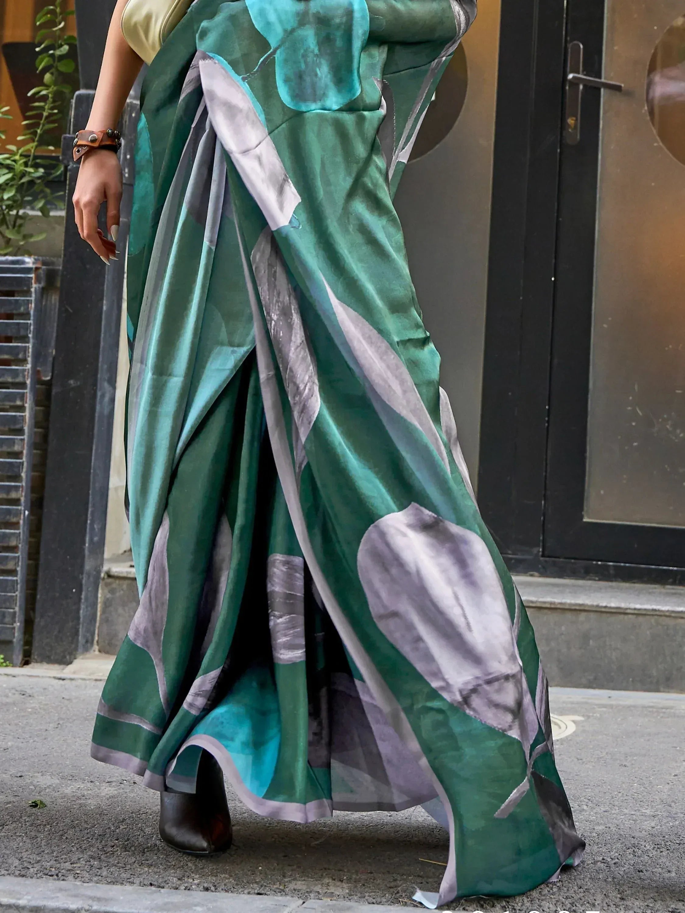 Green and grey printed saree with abstract design, styled with gold blouse for ethnic wear
