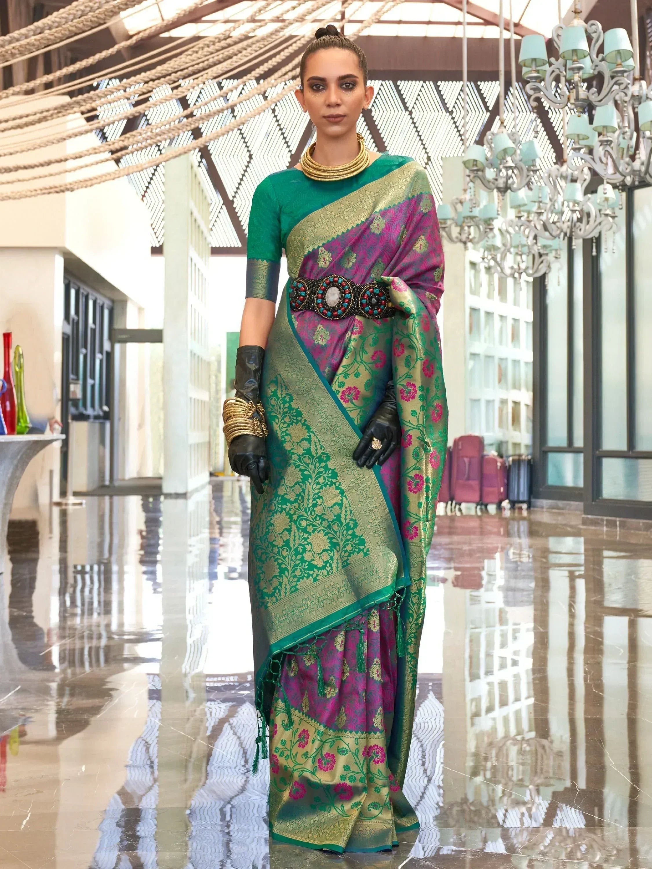 Woman in designer green and pink floral saree with gold embroidery, ethnic wear for festive occasions