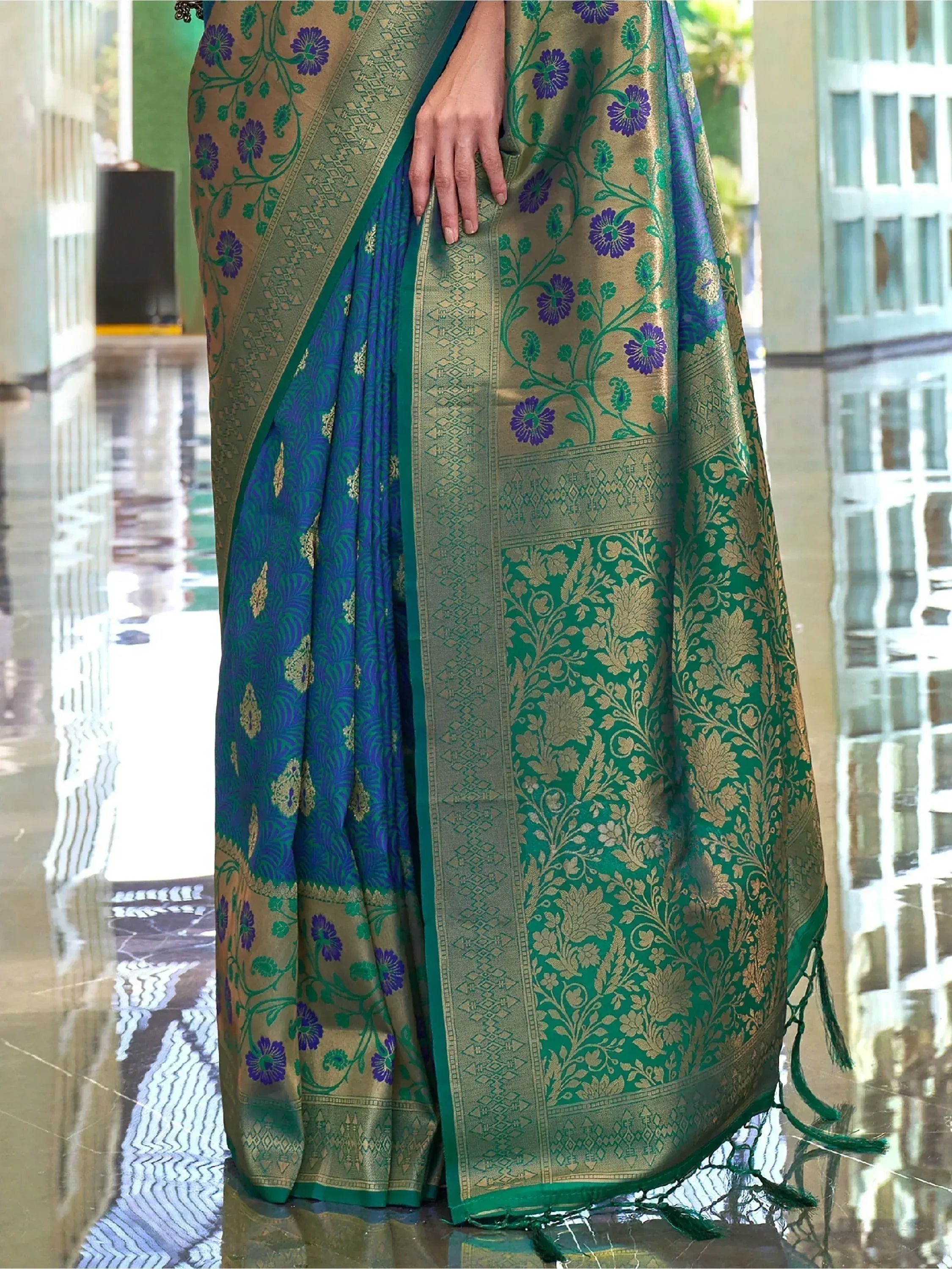 Elegant green and blue floral saree with gold zari work, perfect for Indian ethnic occasions