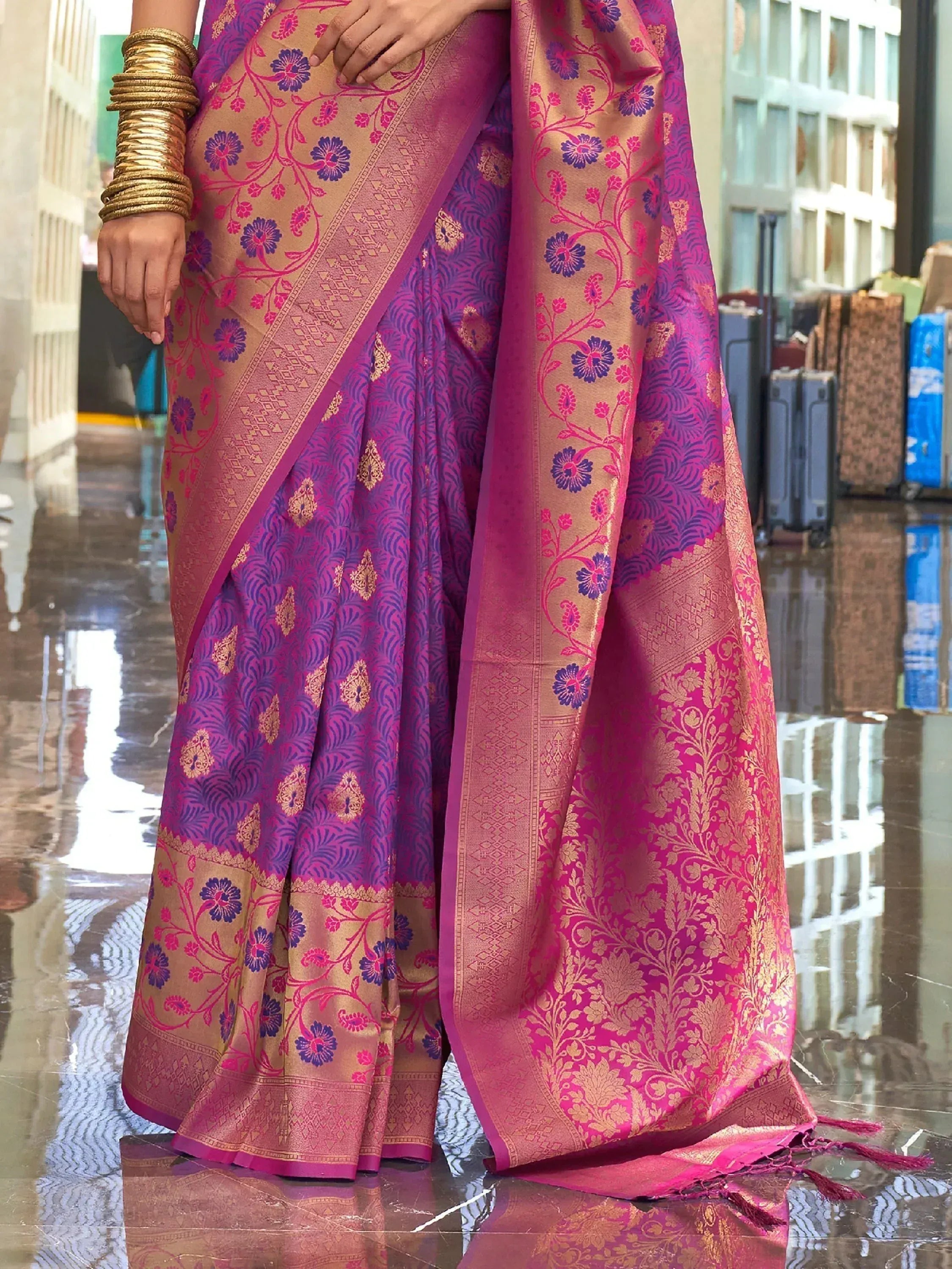 Purple and pink floral Banarasi saree with gold zari work, perfect for Indian ethnic wear occasions.