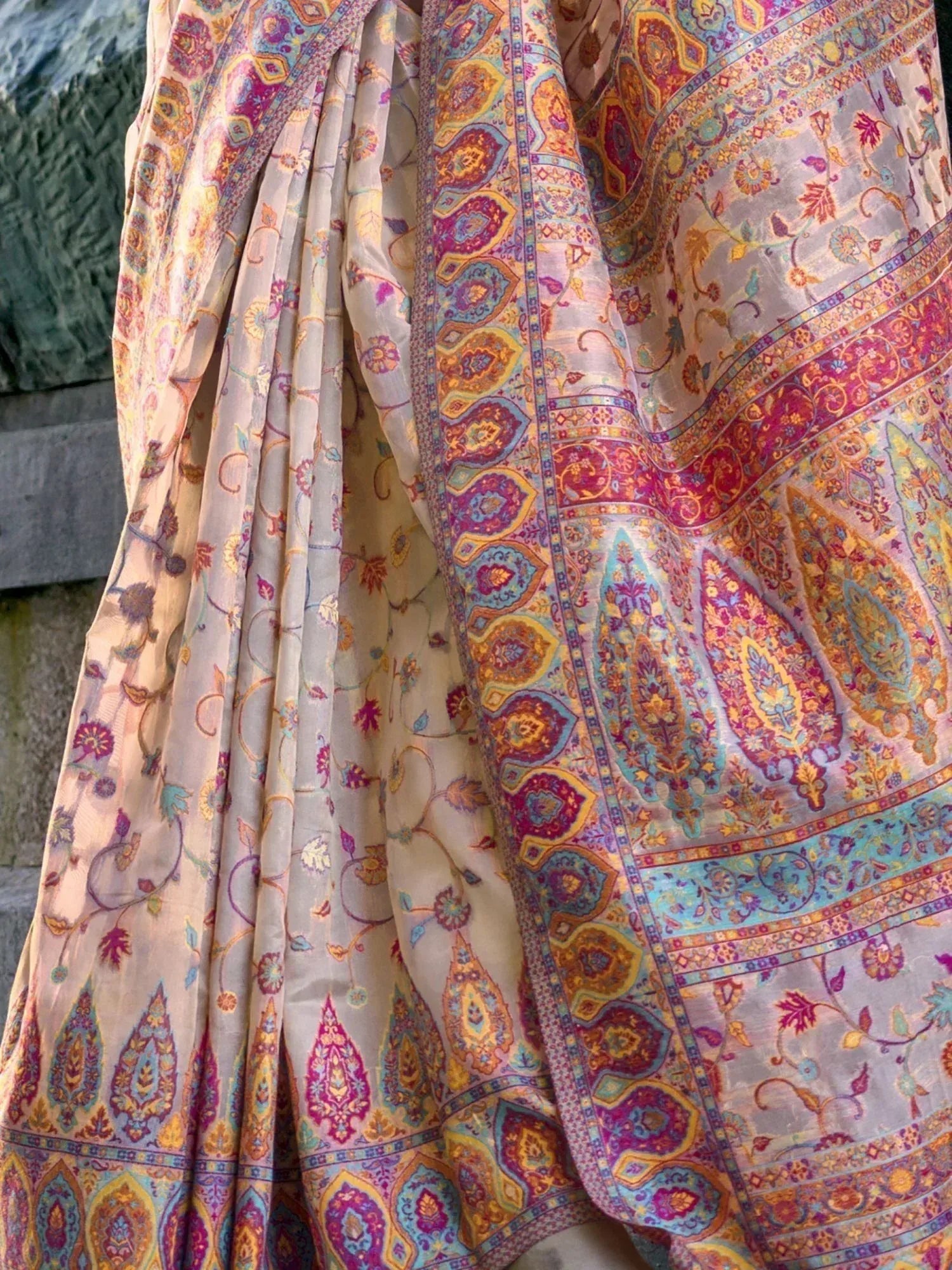 Colorful Indian ethnic saree with intricate paisley and floral patterns, perfect for traditional occasions.