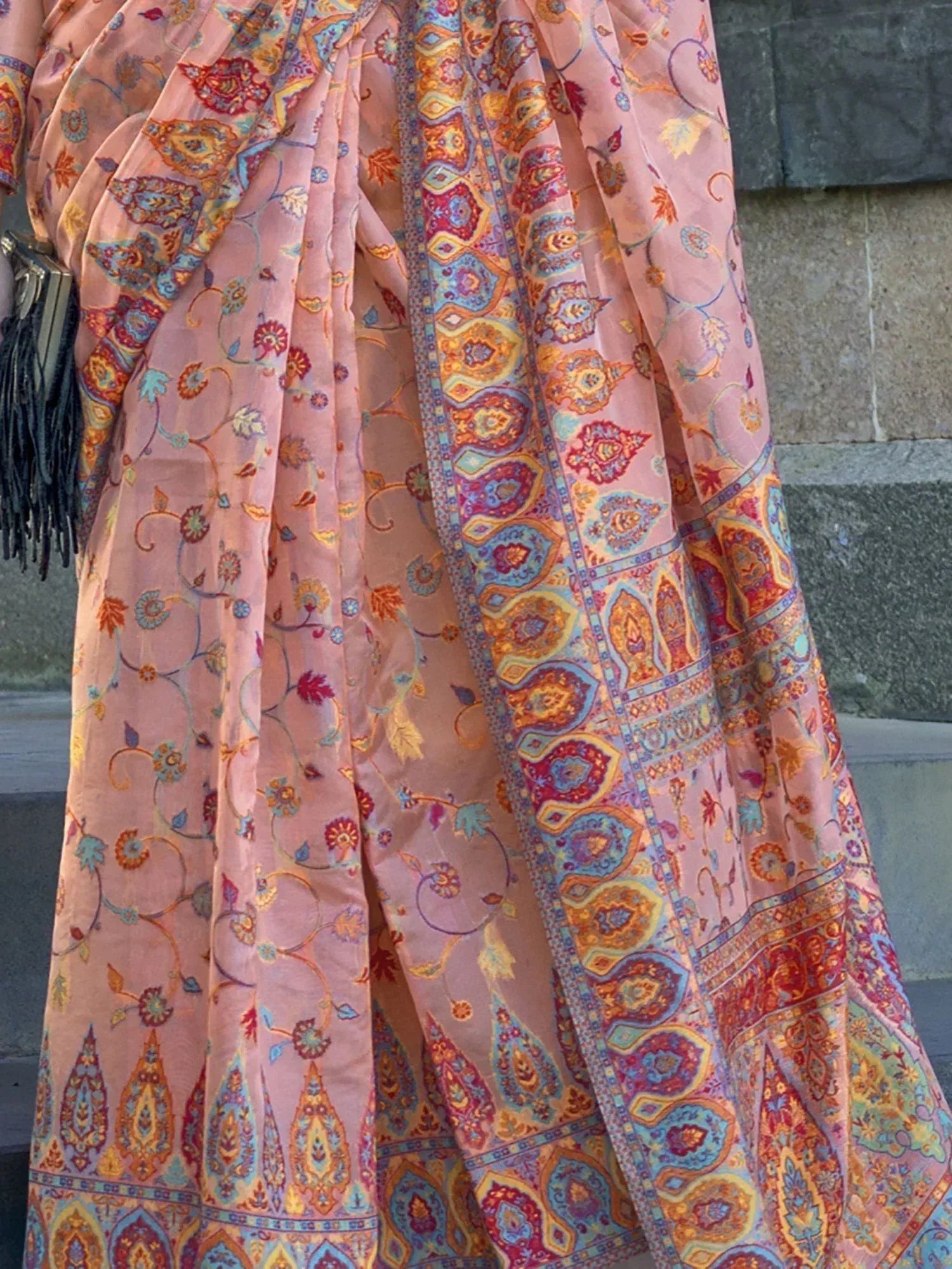 Pink floral and paisley printed saree with vibrant border, ideal for ethnic occasions
