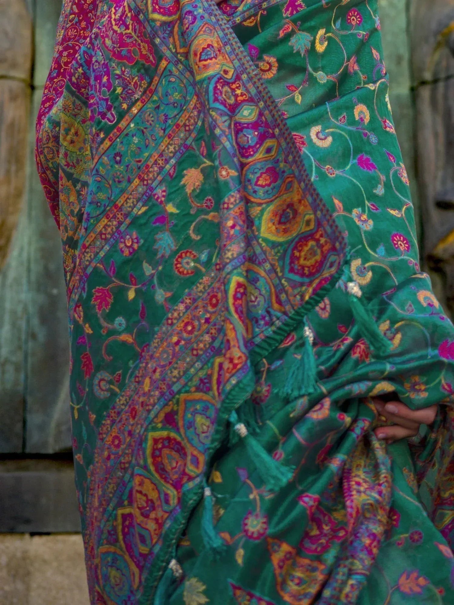 Vibrant green ethnic saree with intricate paisley and floral print, perfect for Indian occasions.