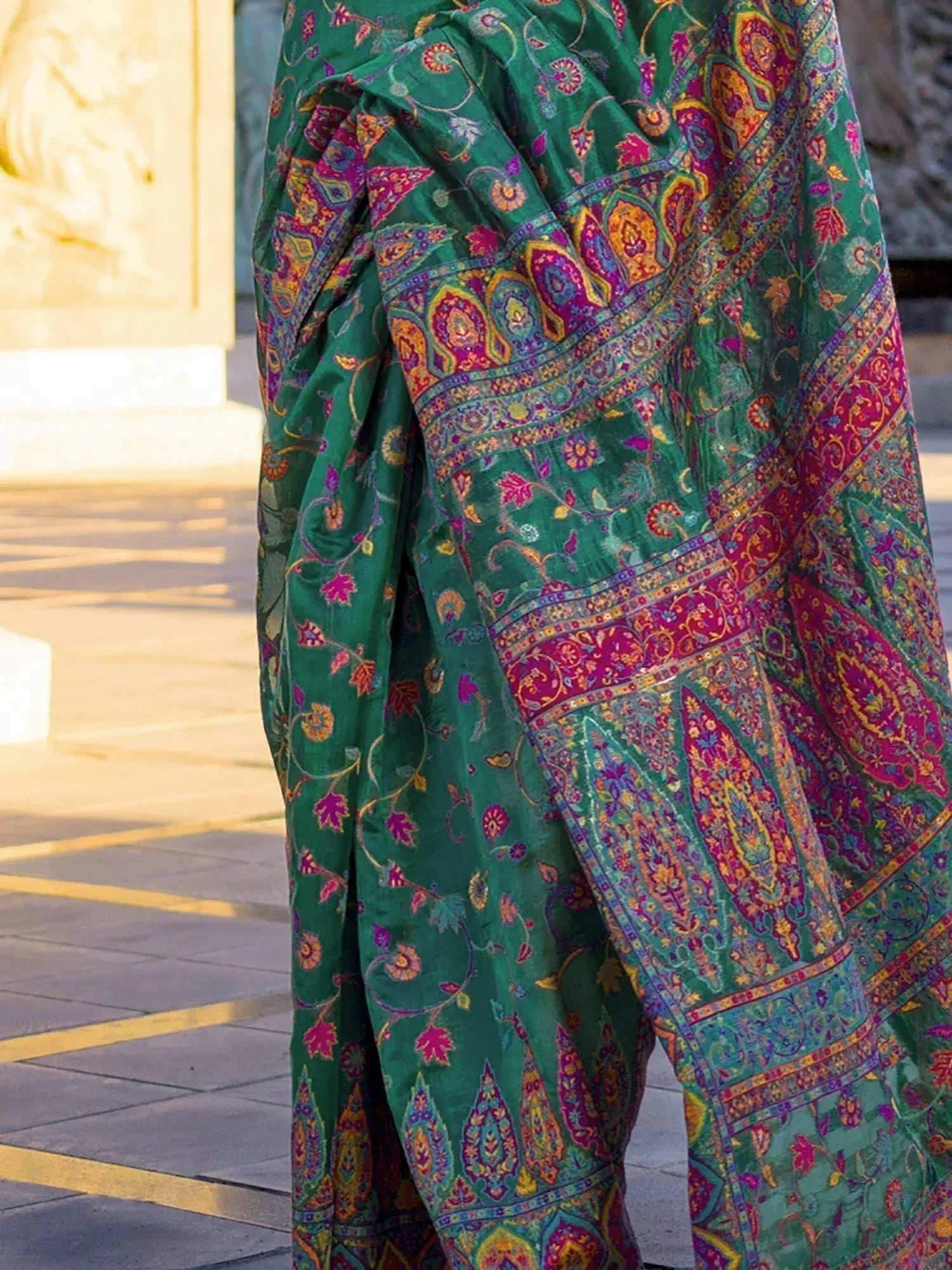 Green ethnic saree with vibrant paisley and floral prints, perfect for Indian occasions