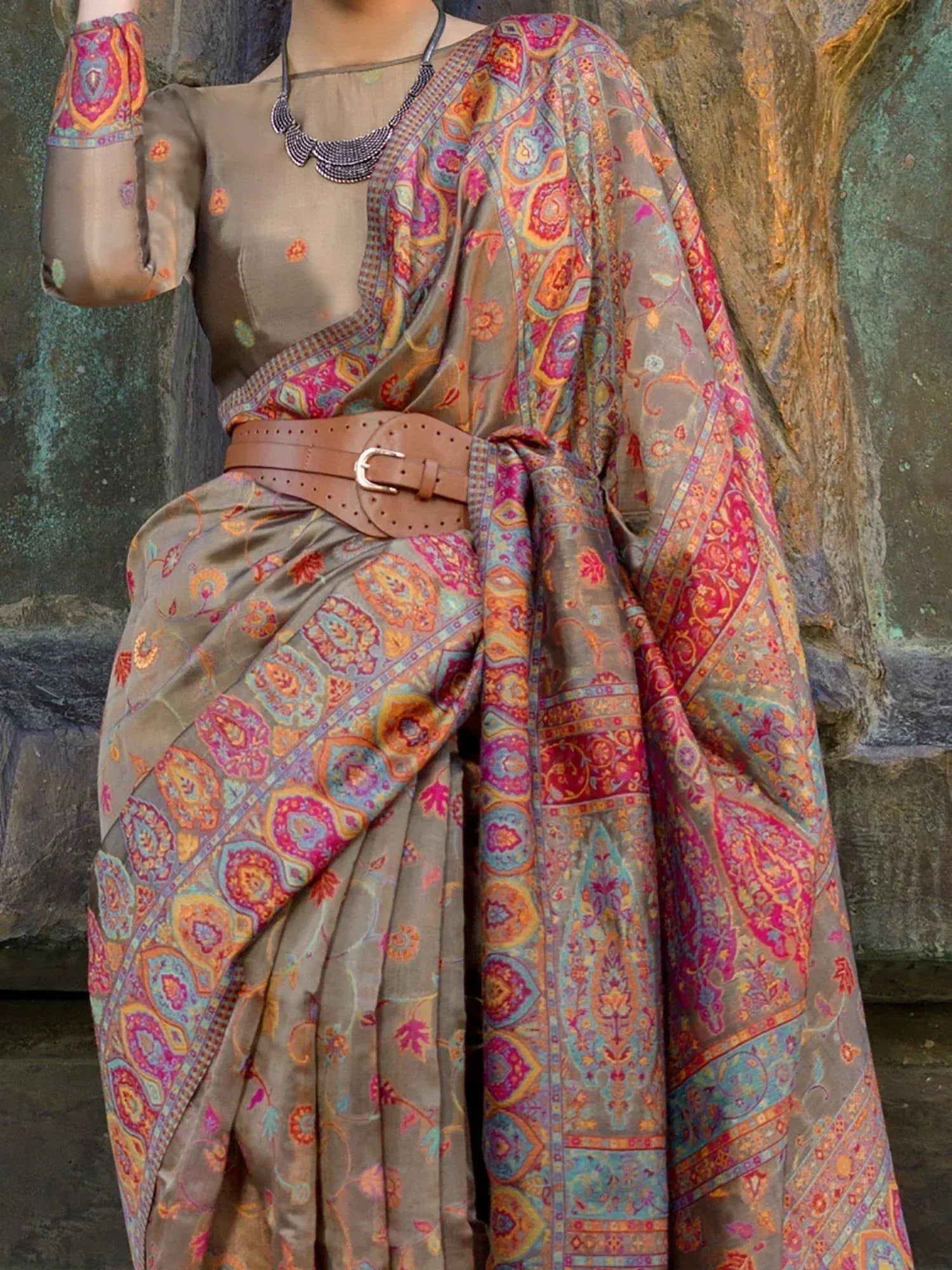 Ethnic saree with vibrant paisley print, brown belt, and sheer blouse for Indian traditional wear